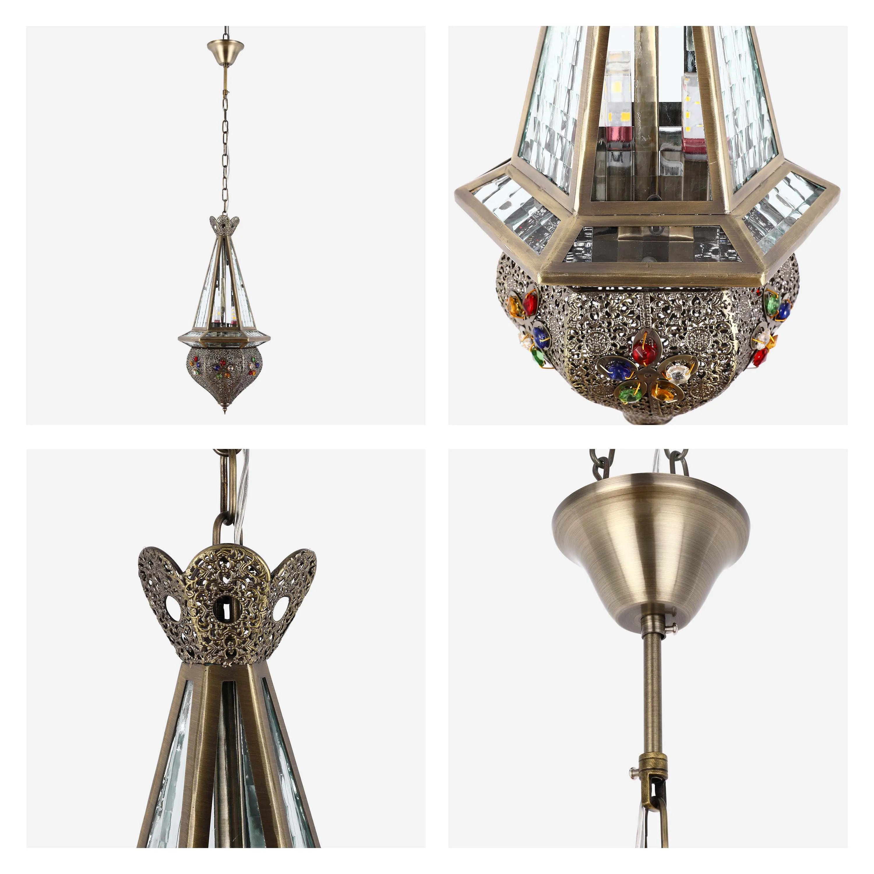 An ornate pendant light fixture featuring jewel accents and a faceted glass shade, suspended by a chain.