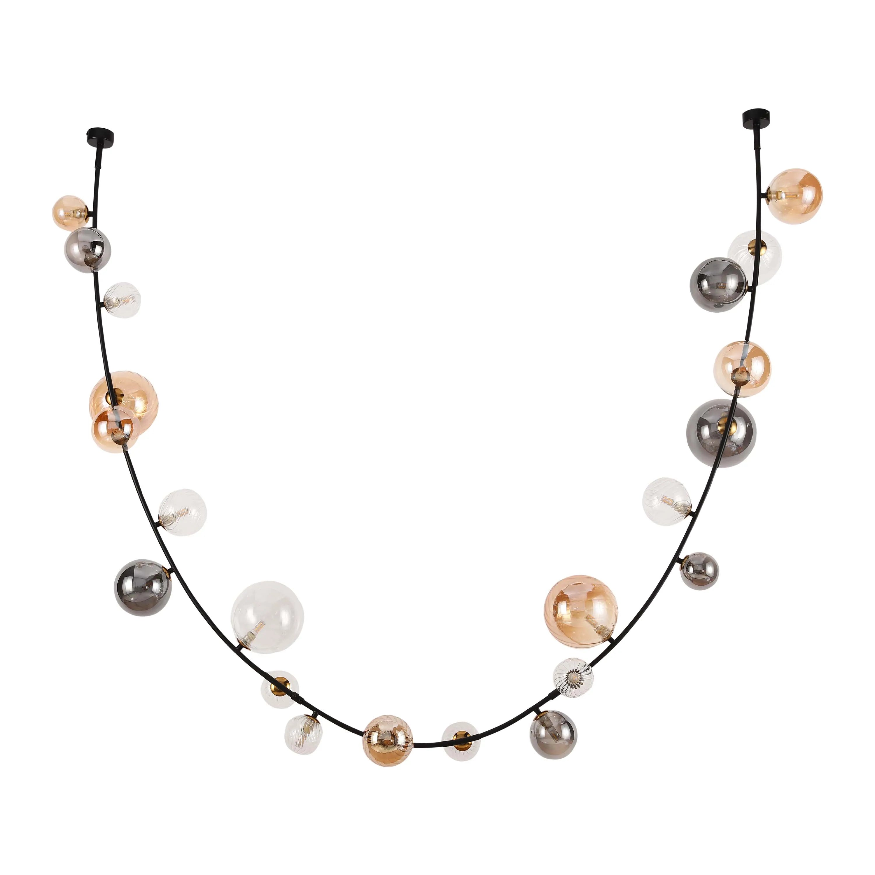 A modern, eye-catching statement lighting fixture with spherical glass shades in amber, smoky grey, and clear finishes.