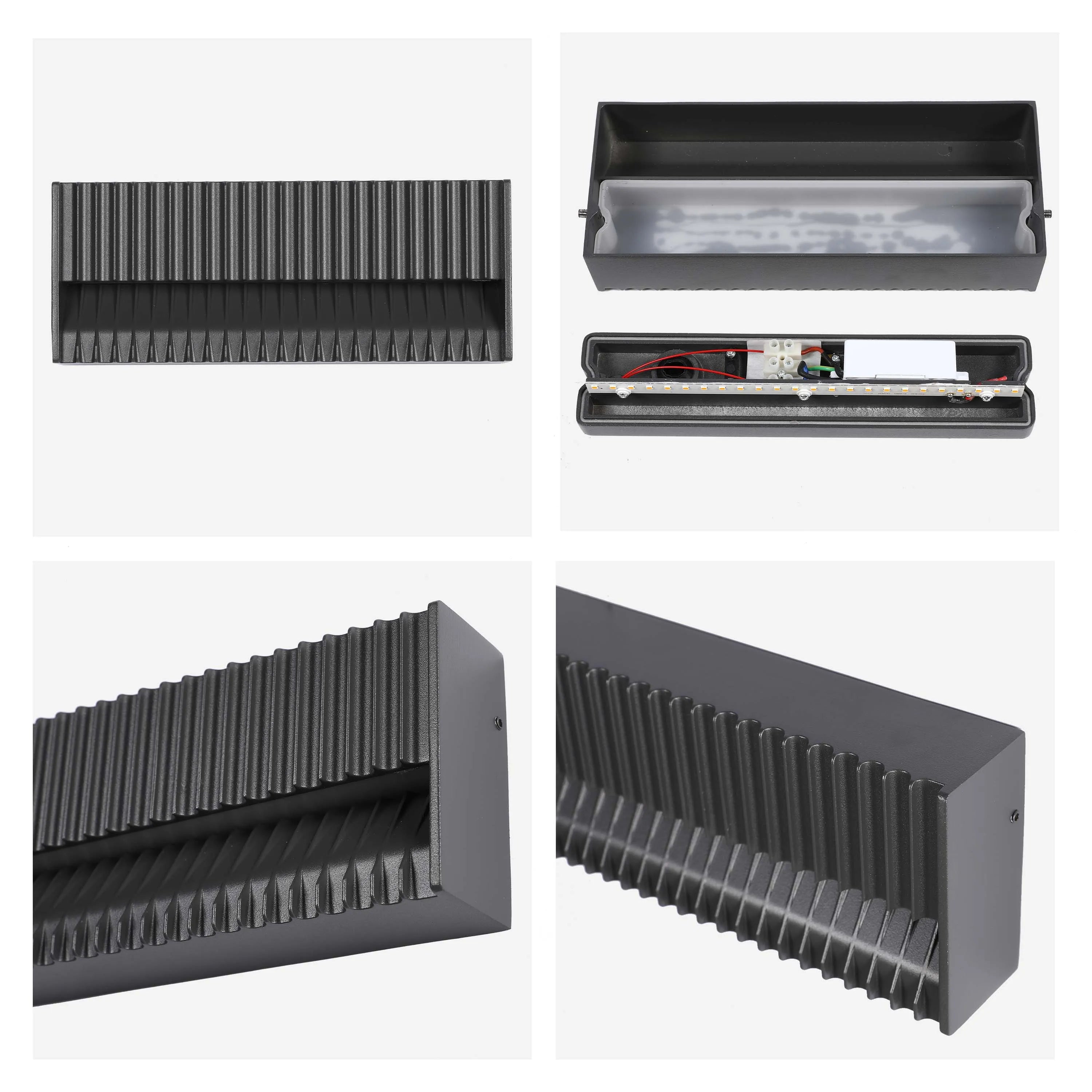 Sleek black wall light with ridged design. Open view reveals its internal components. Contemporary and stylish outdoor lighting solution.