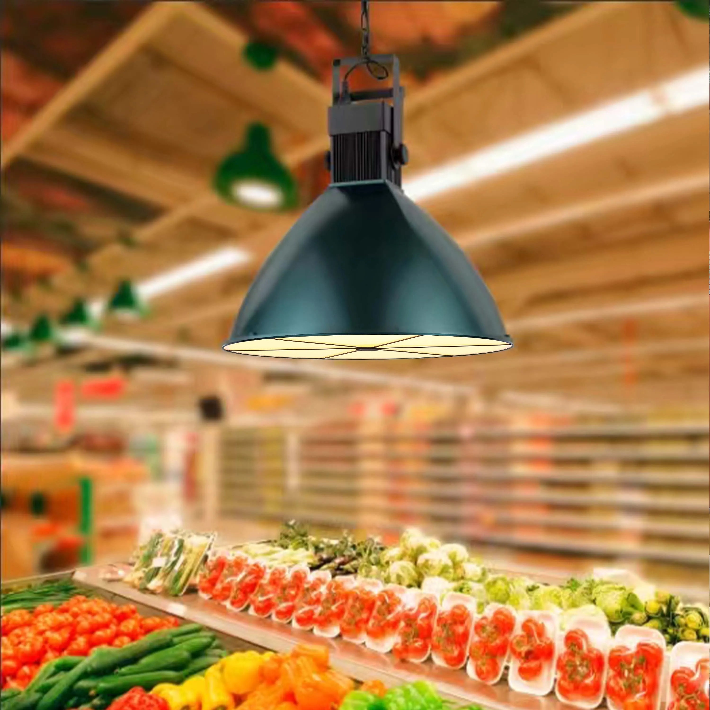 Industrial pendant light illuminates a fresh produce display in a supermarket, showcasing effective retail lighting.