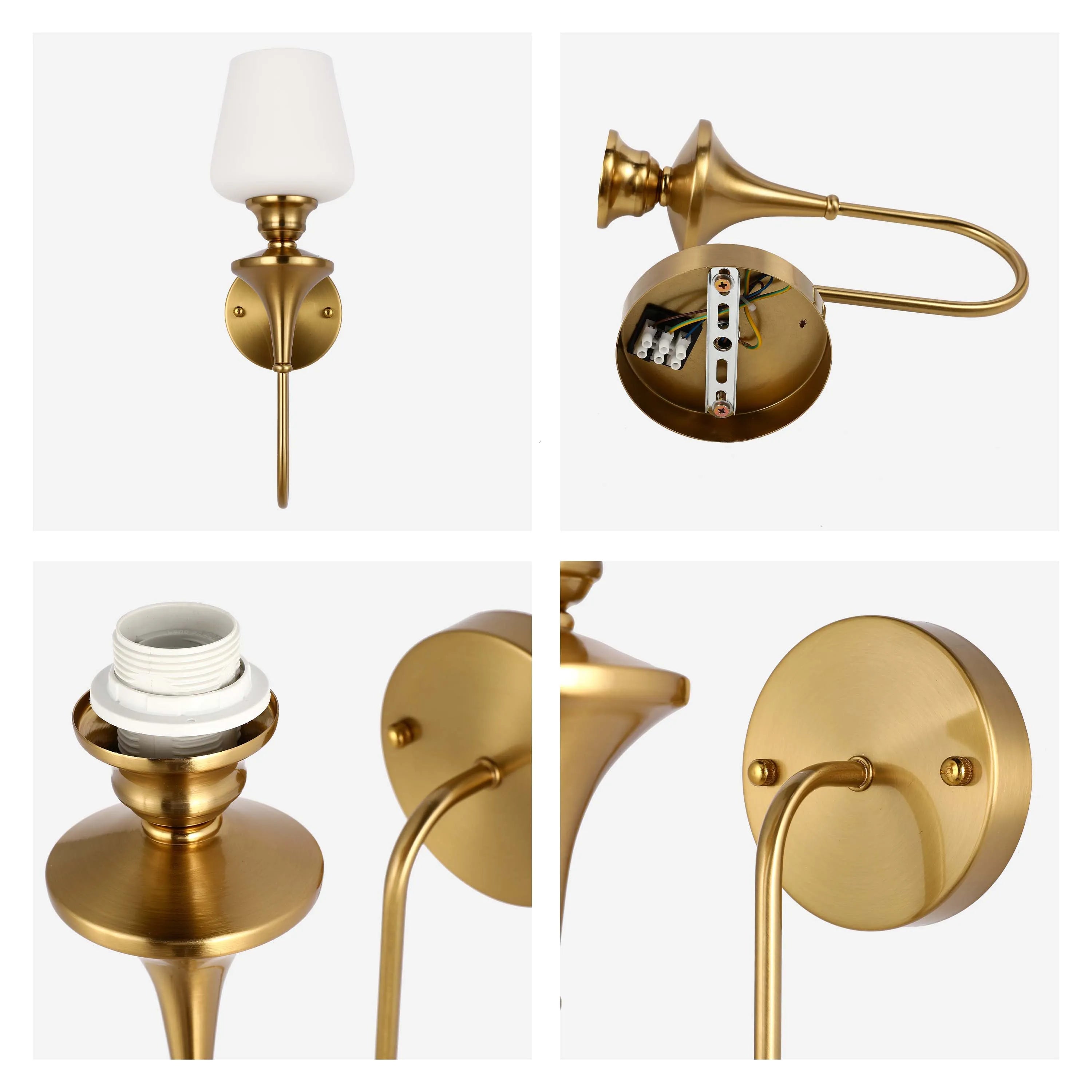 A gold-coloured wall light with a circular base, curved arm, and white glass shade. The light appears to be intended for indoor use.