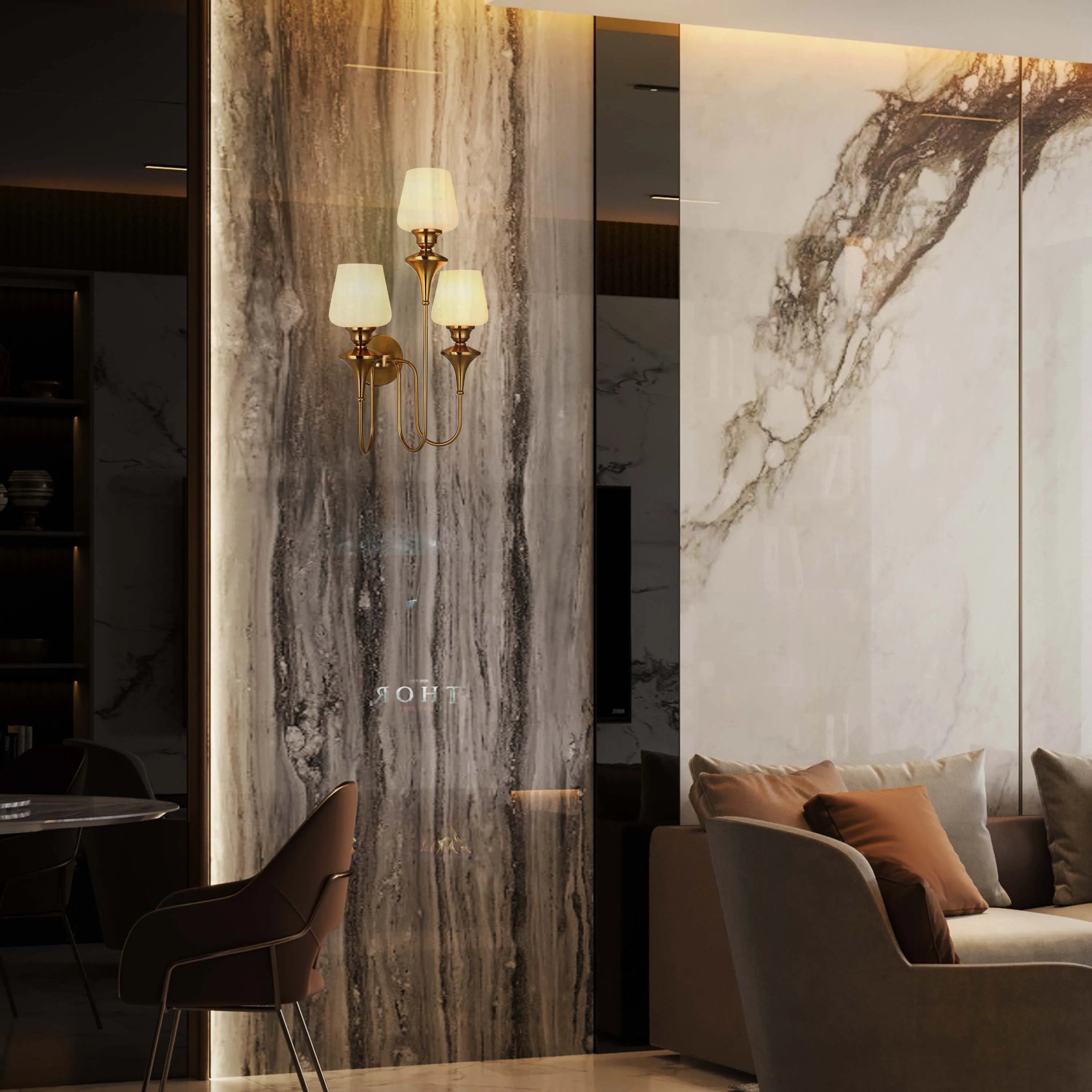 A gold wall sconce with three fabric shades adorns a marble wall, adding a touch of elegance to this luxurious interior.