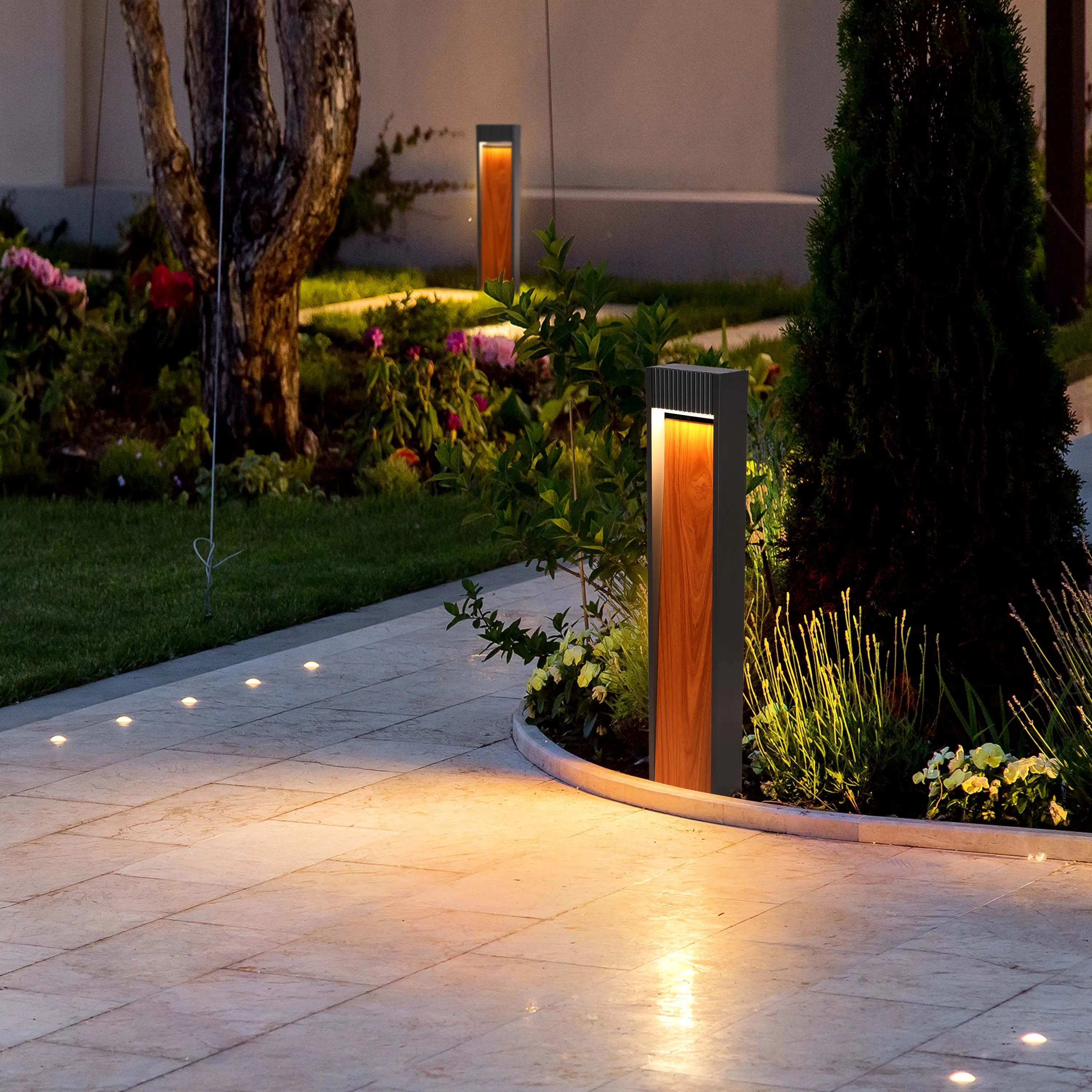 Garden path lights illuminate stone paving & flowerbeds. Wood & metal bollard lights add style with an upward, warm glow.