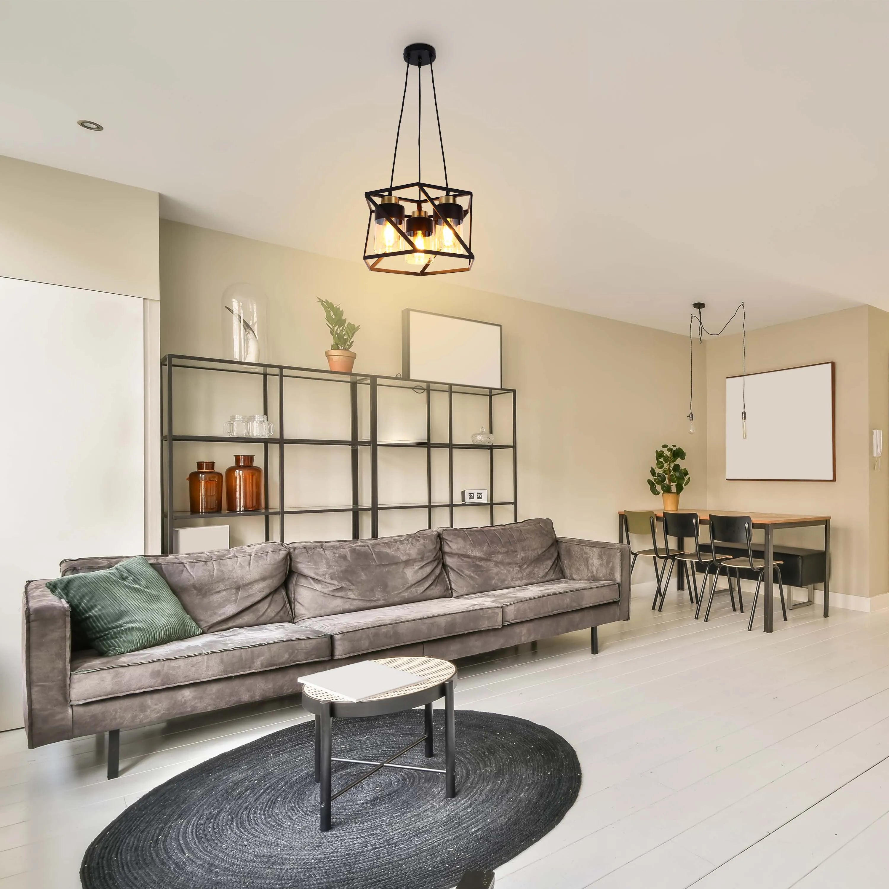 A modern living room featuring stylish pendant lighting, creating a warm and inviting atmosphere. The lamps have decorative shades.