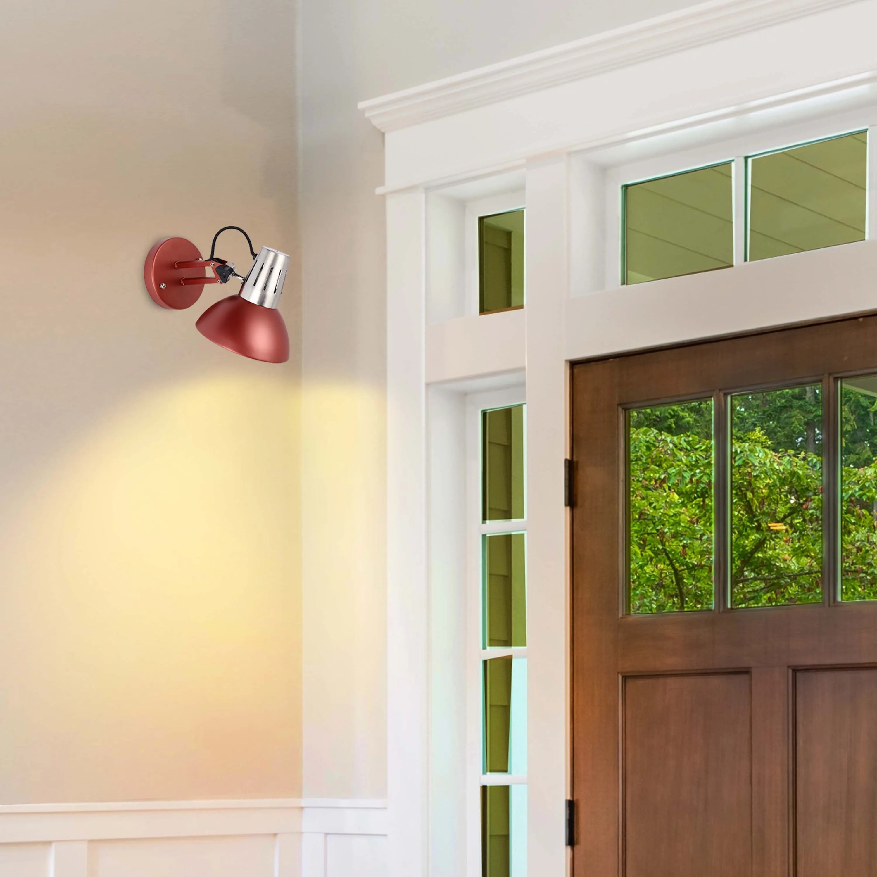 A red wall lamp providing direct, warm lighting to a neutral-toned room with an adjacent wooden door.
