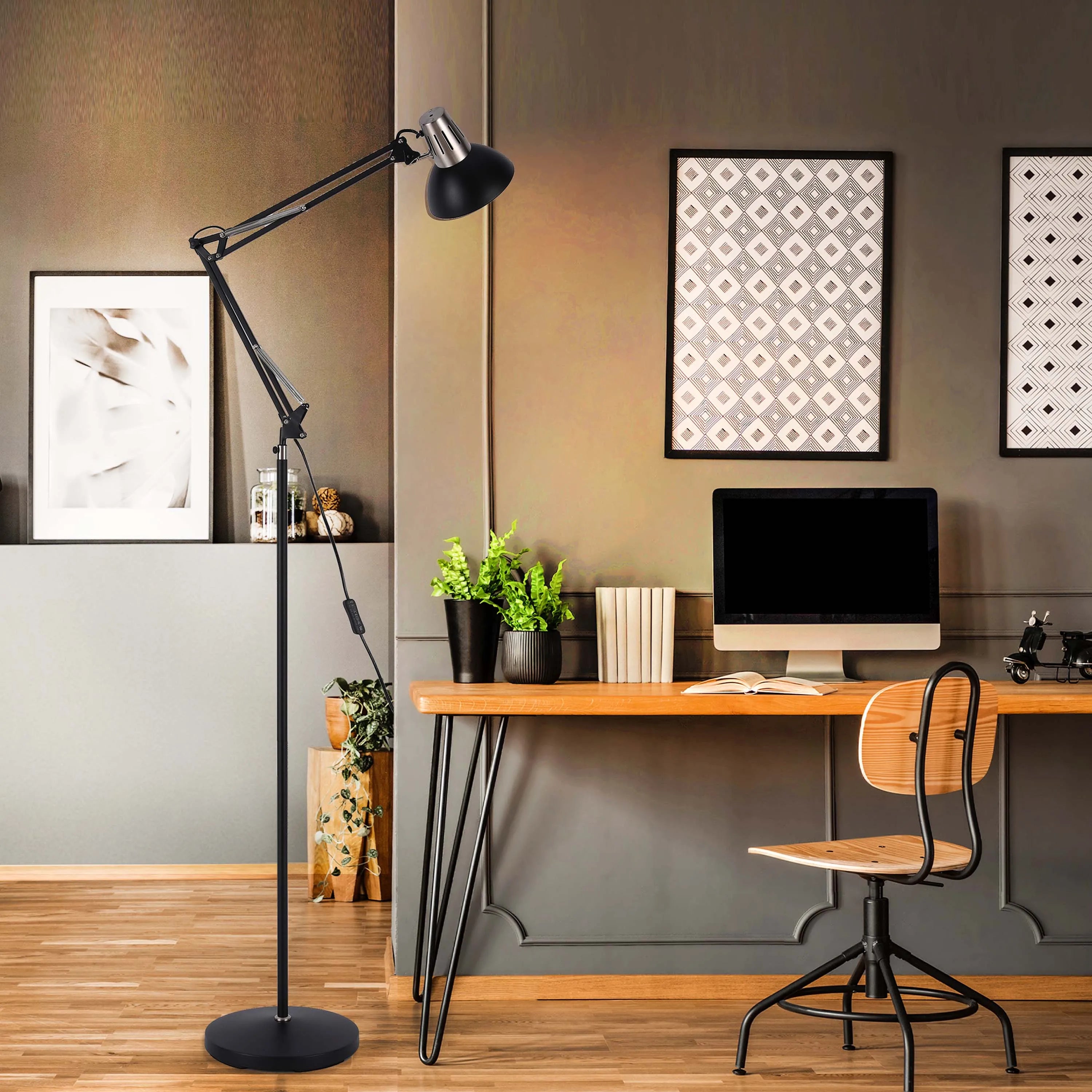 A black adjustable floor lamp illuminates a workspace, enhancing both style and functionality.