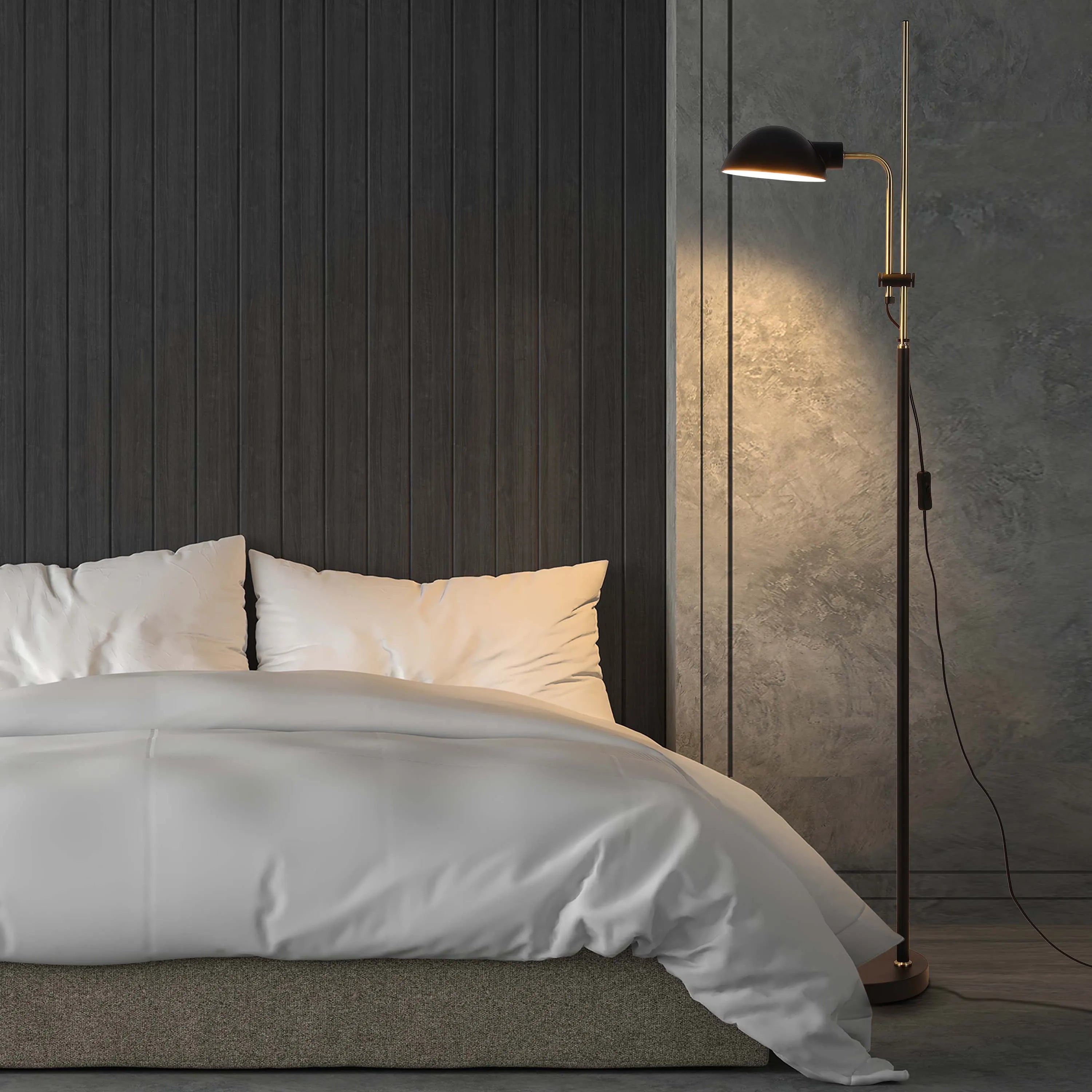 A floor lamp provides warm light in this bedroom setting, accentuating the textured wall and the crisp, white bedding.