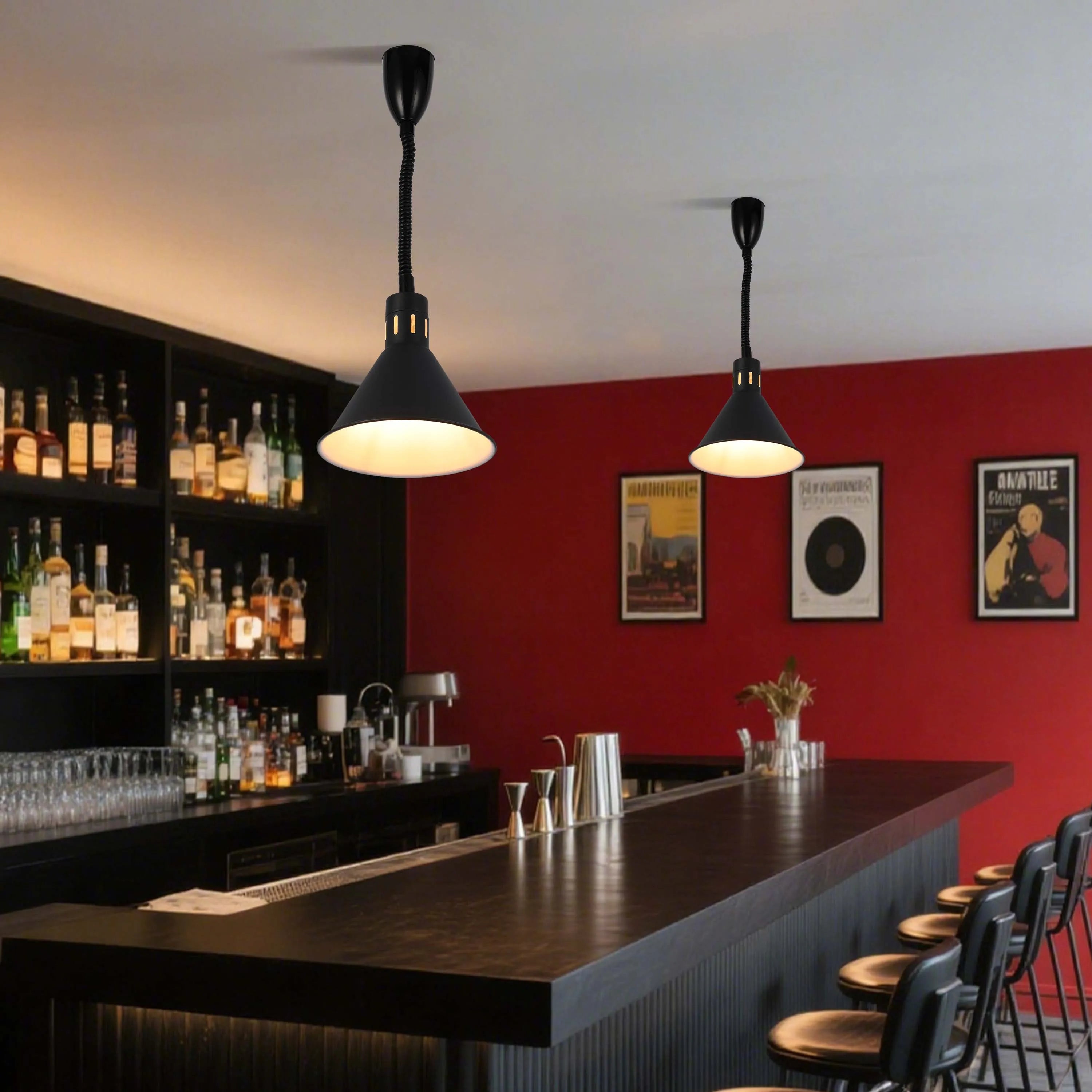 Contemporary black pendant lights illuminate a stylish bar, casting a warm glow over the counter and creating an inviting atmosphere.
