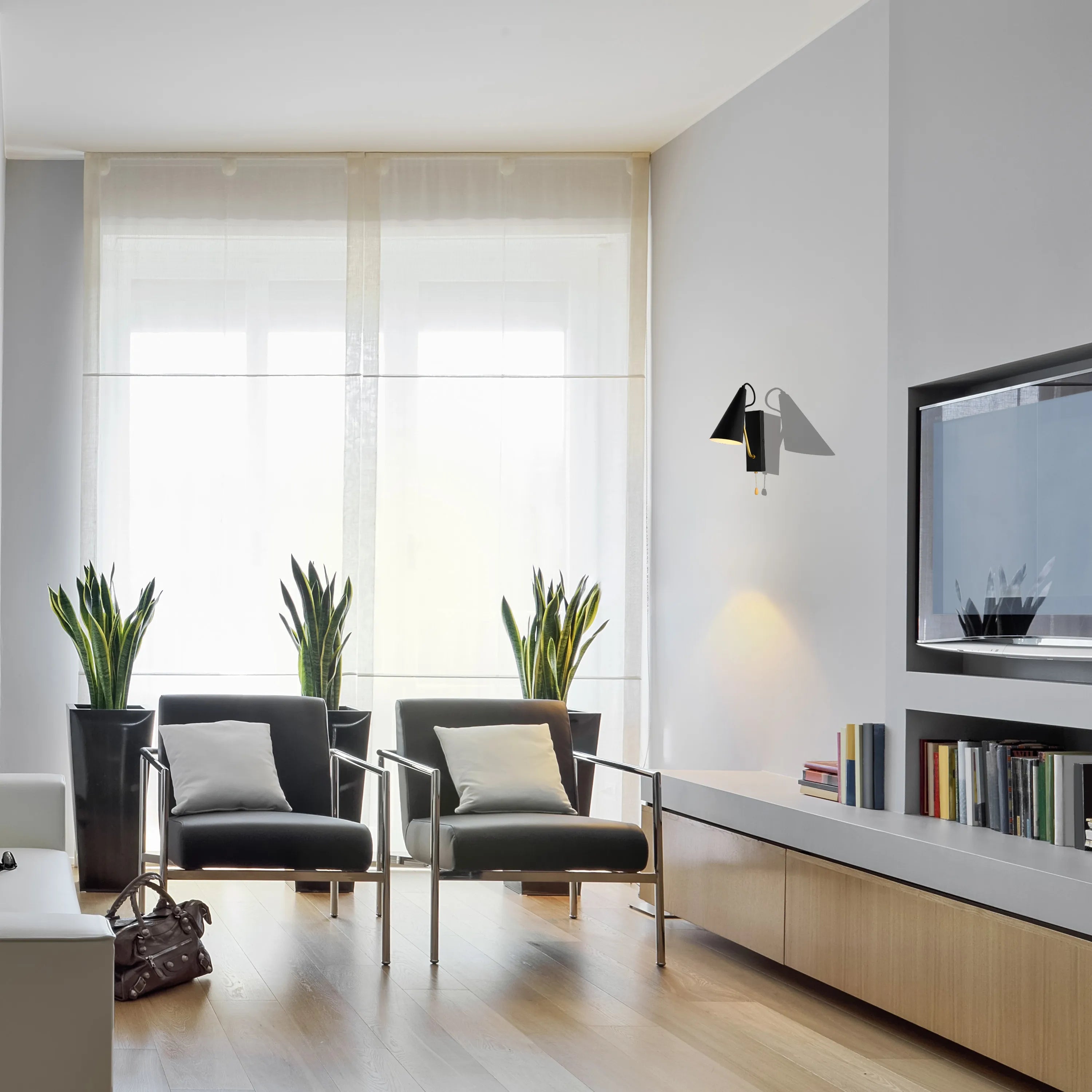 Contemporary lighting: a wall-mounted sconce provides warm accent lighting in a modern living room with natural light from large windows.
