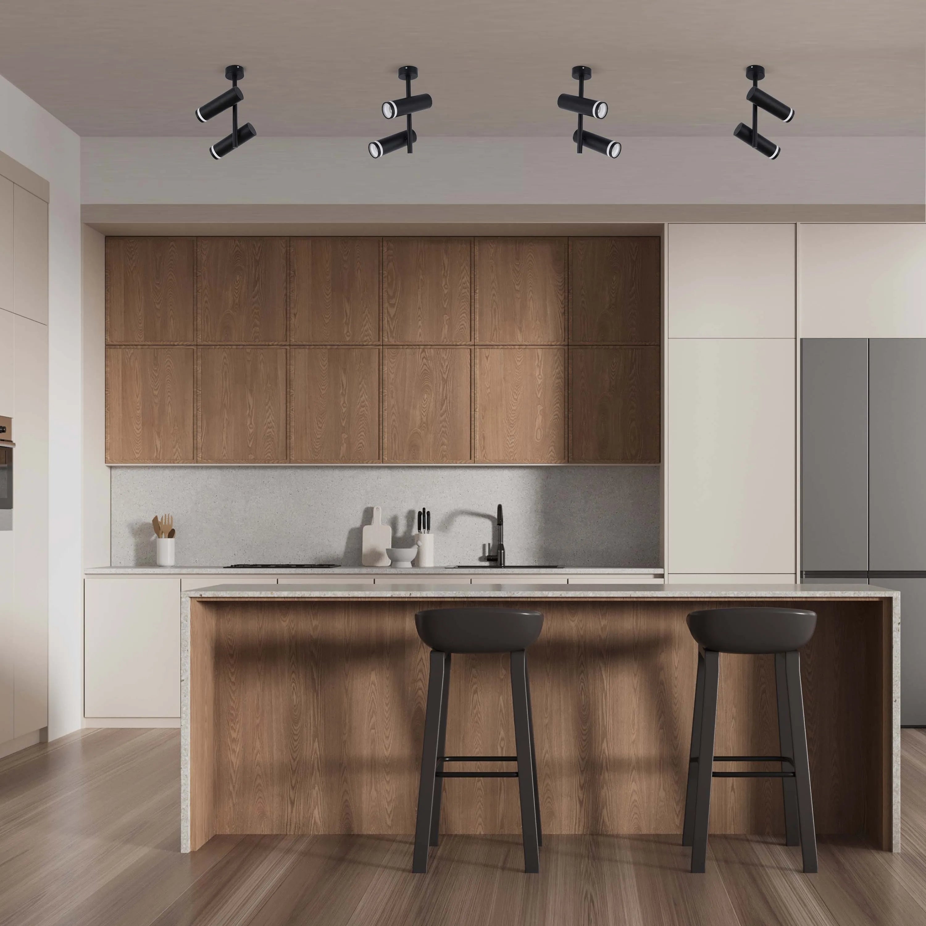 A kitchen with modern track lighting featuring black fixtures with adjustable spotlights, creating a sleek and functional lighting design.