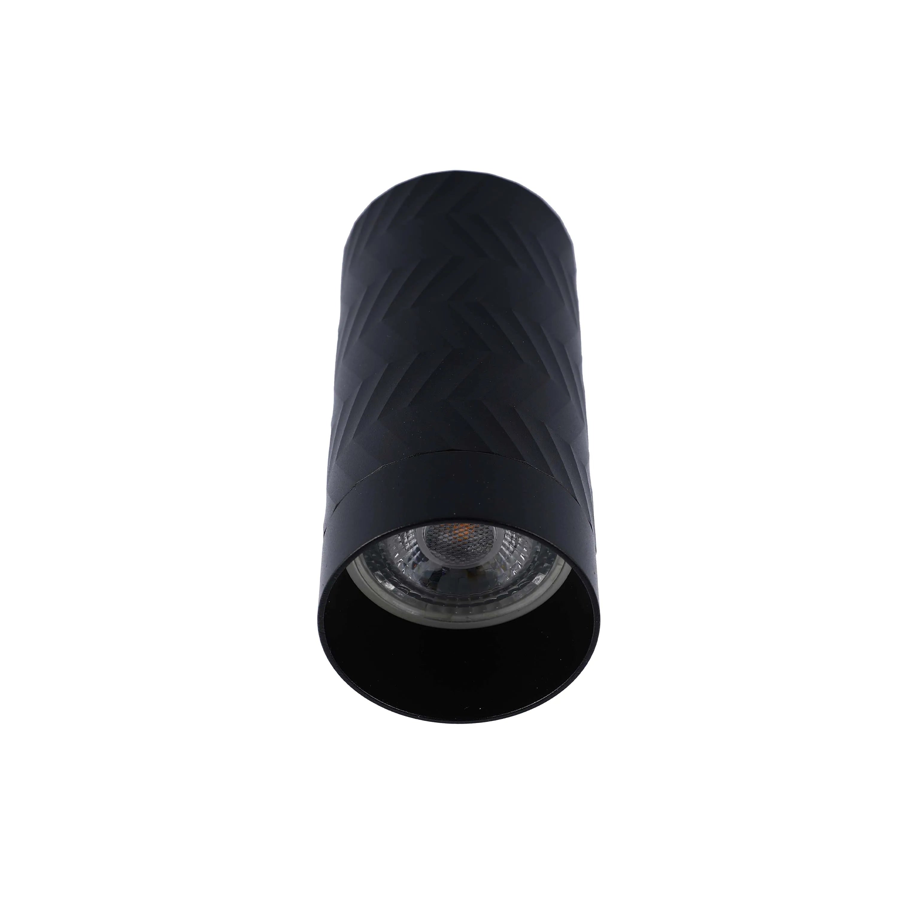 A modern, textured black spotlight emits a bright light. Sleek, minimalist design for contemporary interiors.