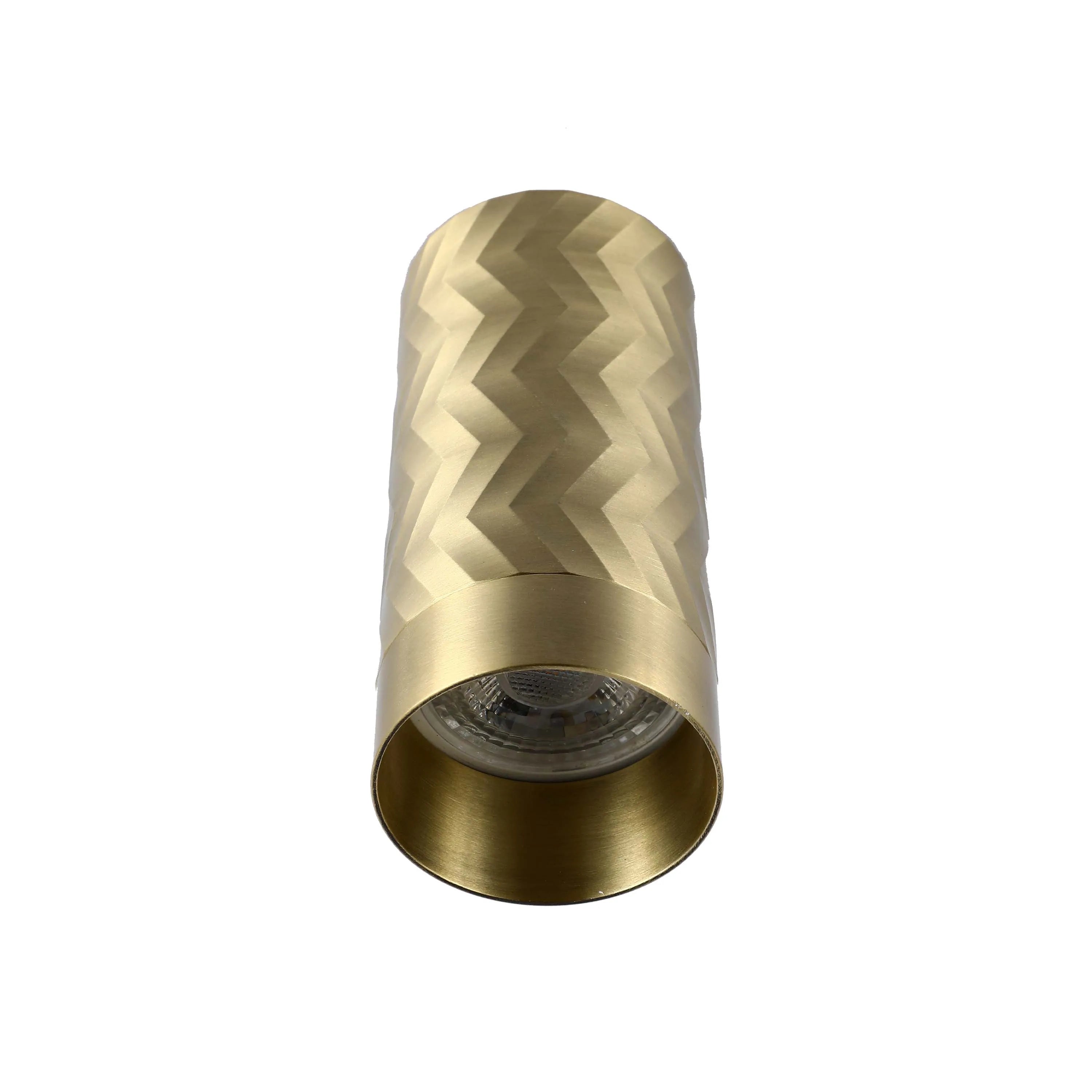 Textured gold wall light, cylindrical in shape with a visible bulb at the bottom. Adds a touch of contemporary glamour to any space.