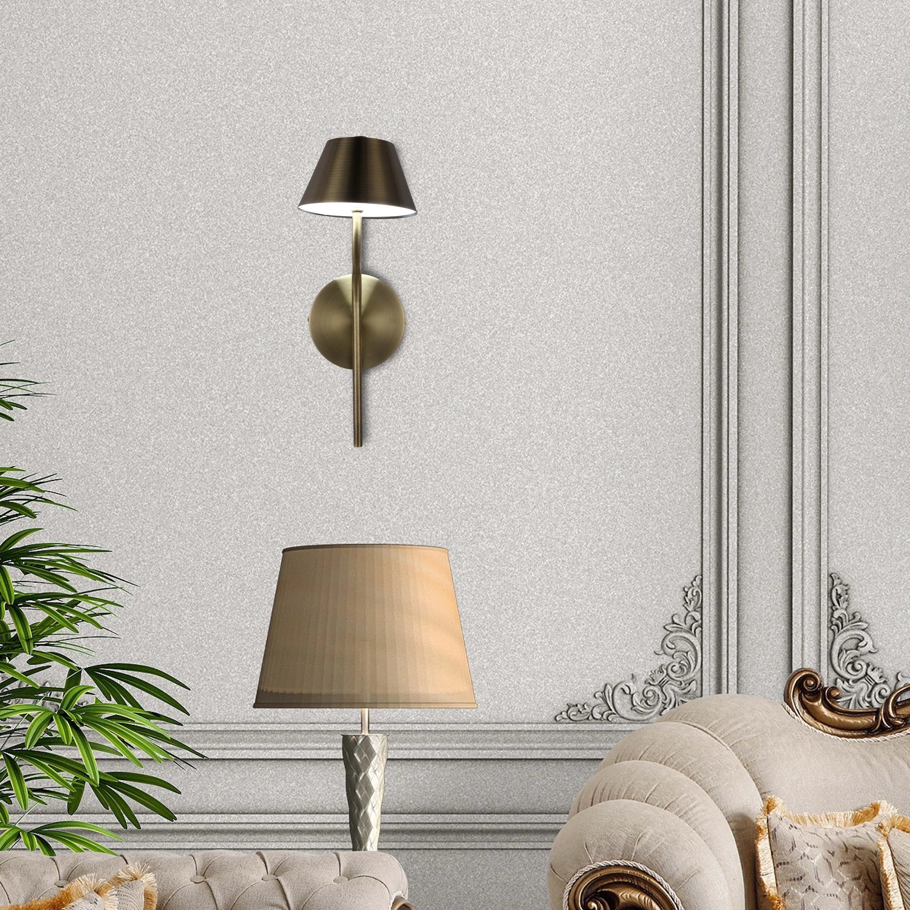 Elegant lighting fixtures illuminate the room. A wall sconce provides focused light while a table lamp adds ambient warmth.