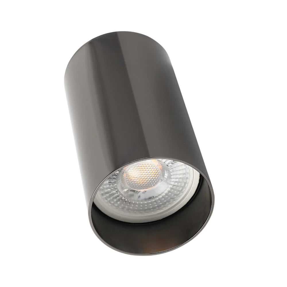 A sleek, cylindrical downlight with a warm, inviting glow. Perfect for modern interiors.