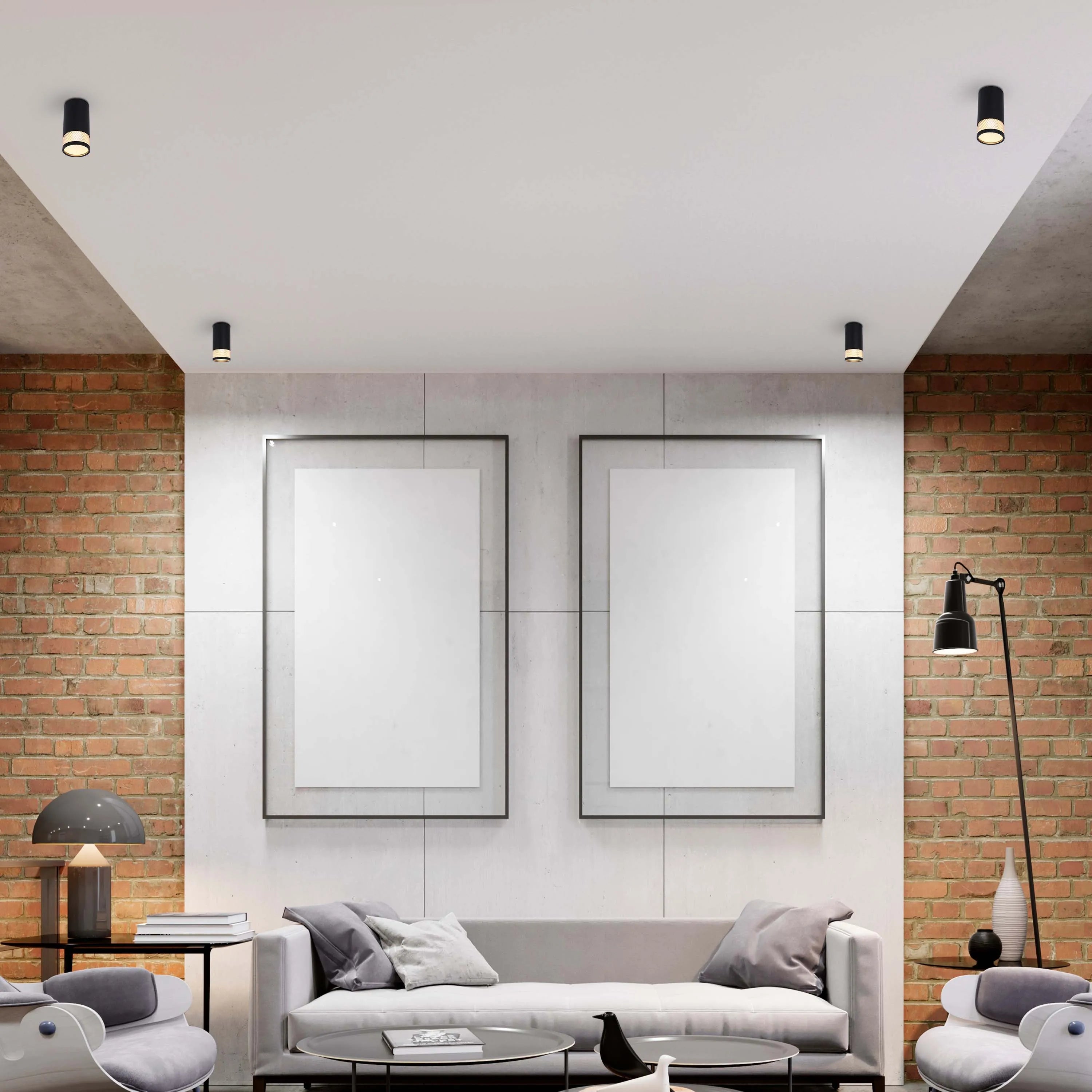 Contemporary living room with black ceiling spotlights, table lamps, and a floor lamp. Offers a warm, inviting atmosphere.