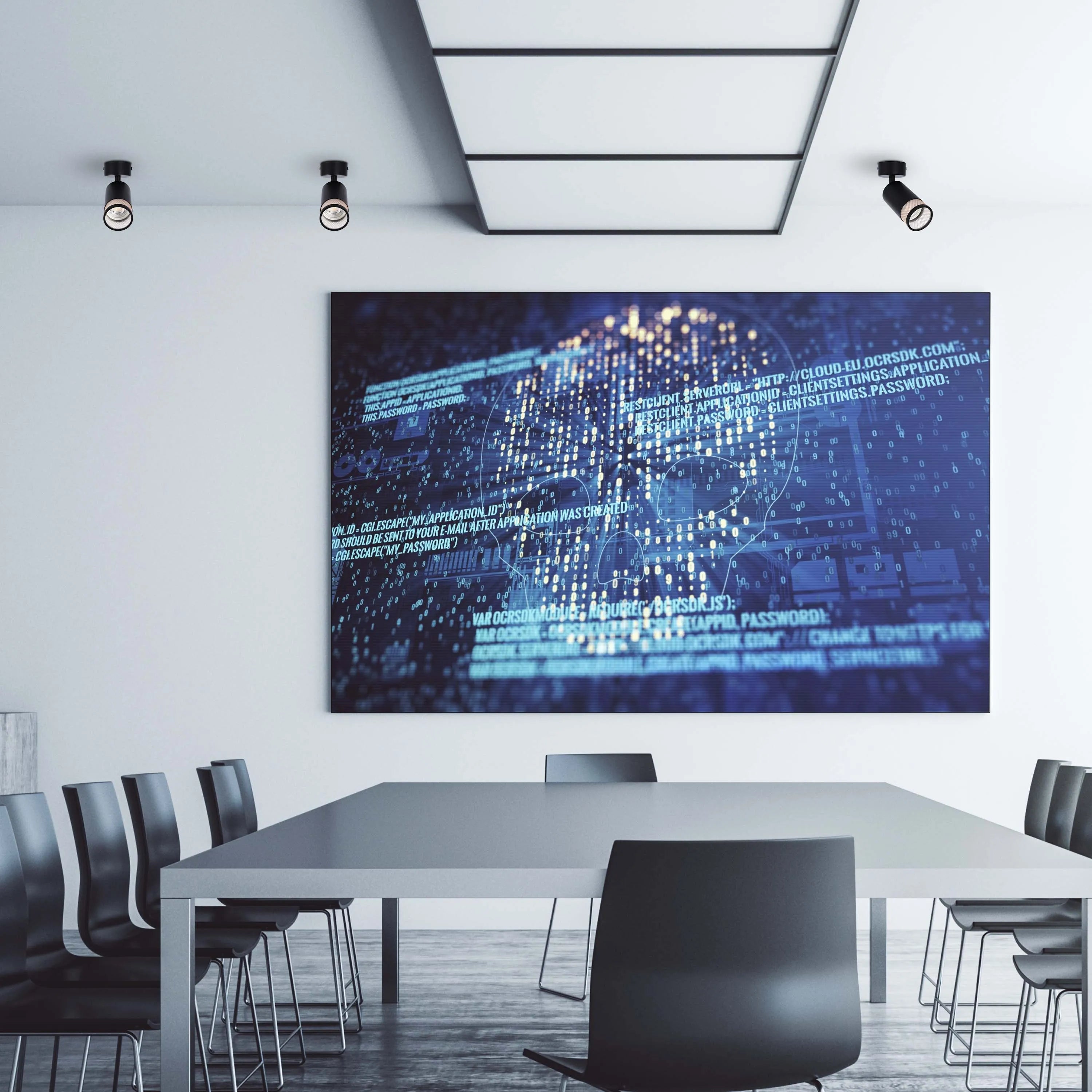 Modern office lighting featuring track spotlights and a recessed ceiling light, illuminating a contemporary conference room.