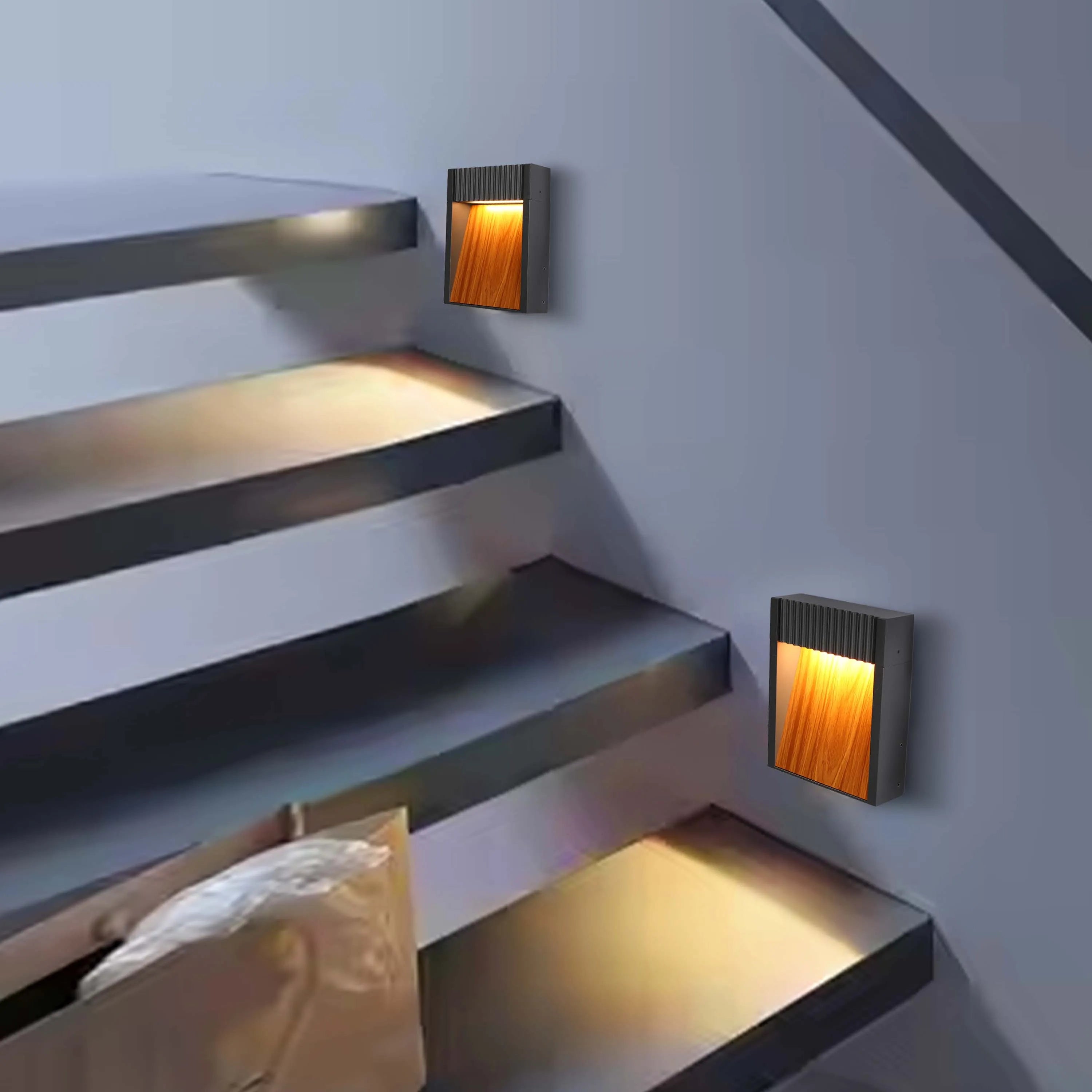 Stylish, modern staircase lights cast a warm glow, enhancing both safety and aesthetics.