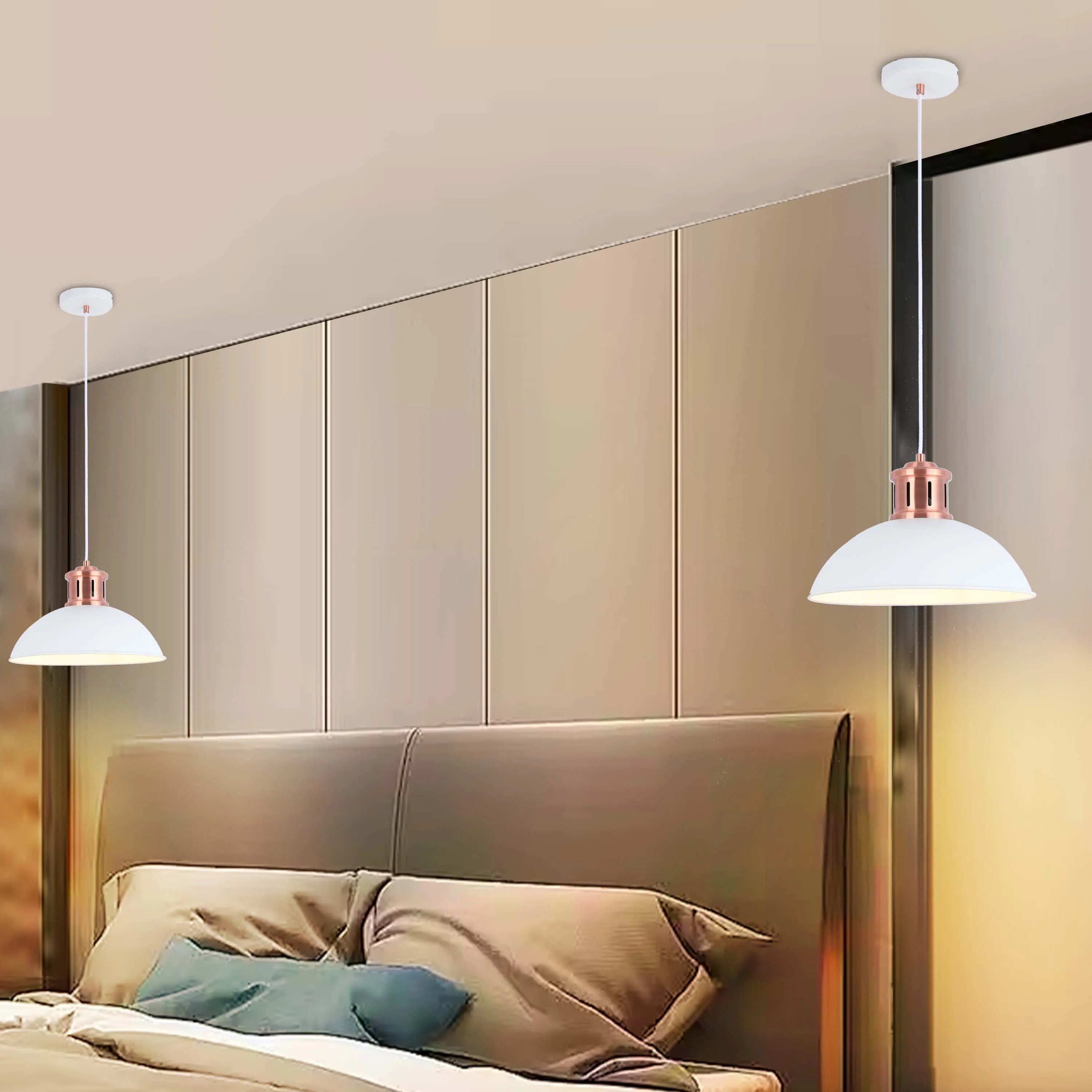 Bedroom scene featuring two stylish, white pendant lights with copper detail hanging from the ceiling.