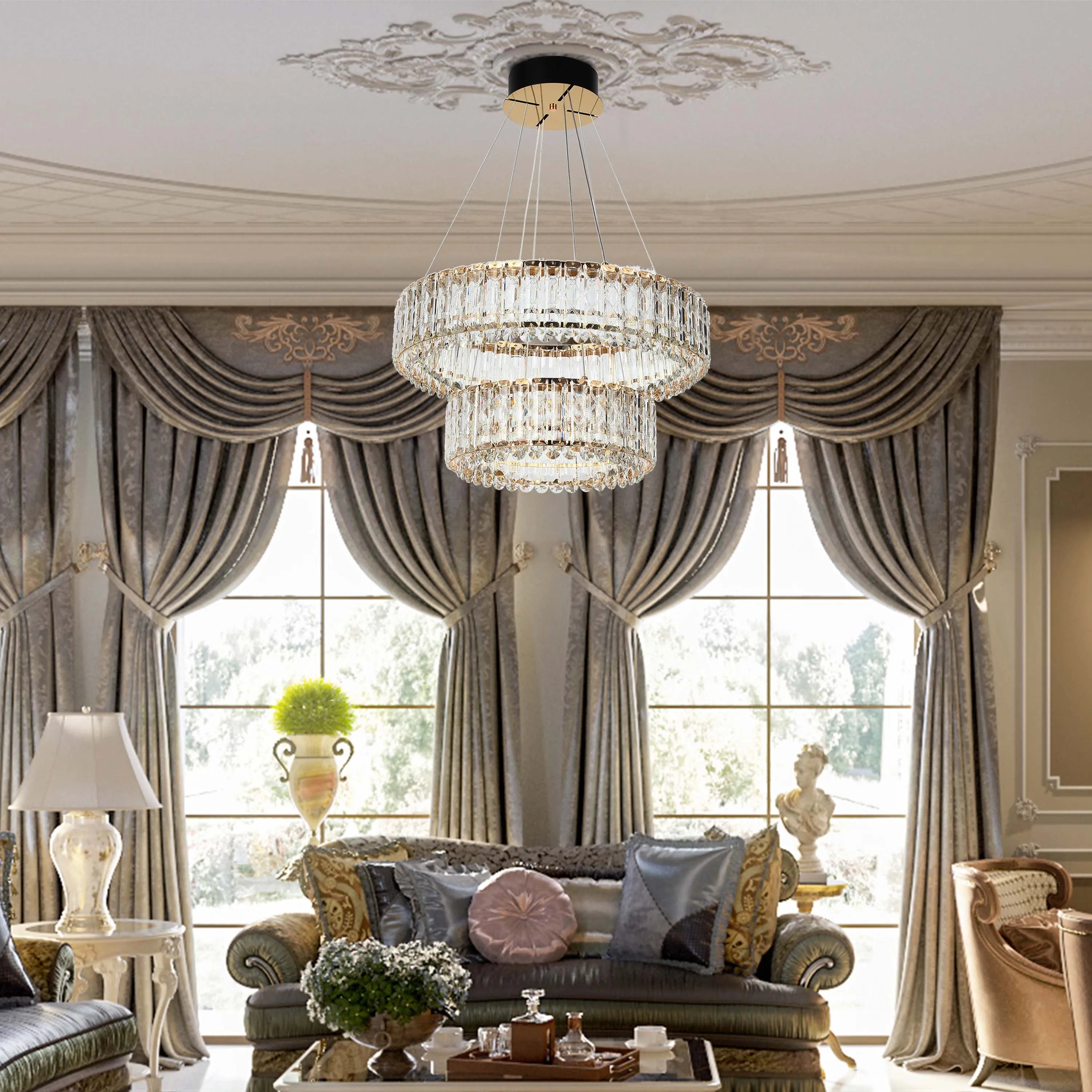 An opulent two-tier crystal chandelier illuminates this interior, providing a luxurious glow. The curtains add to the room's grandeur.