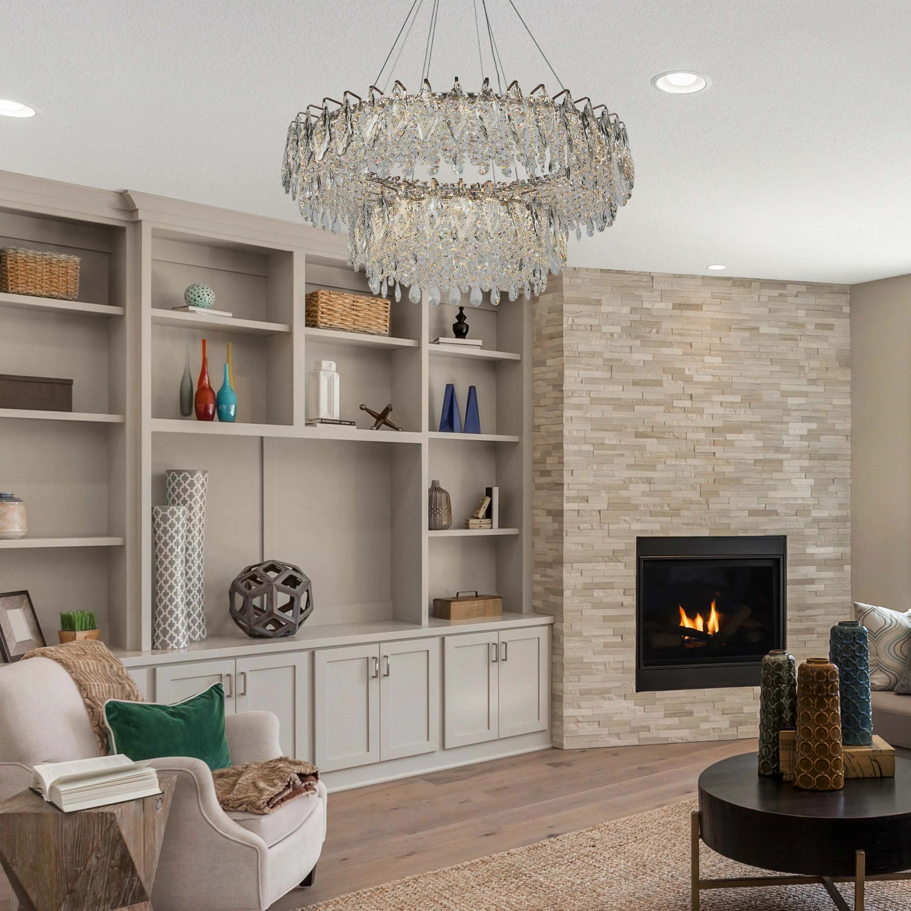 Crystal chandelier suspended above the room. Recessed lighting offers additional illumination for a bright and welcoming atmosphere.