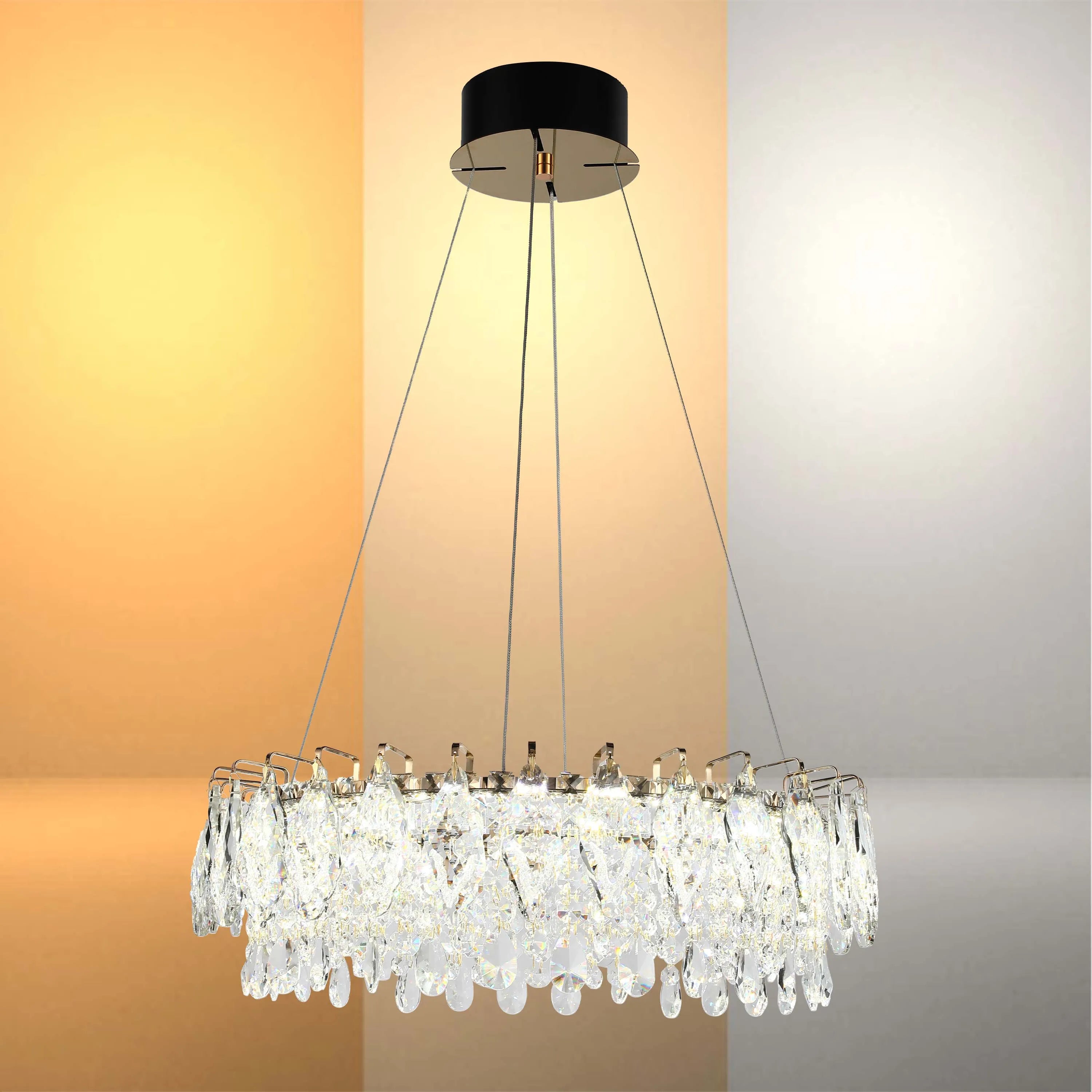 A round, crystal chandelier with warm, neutral, and cool lighting options.