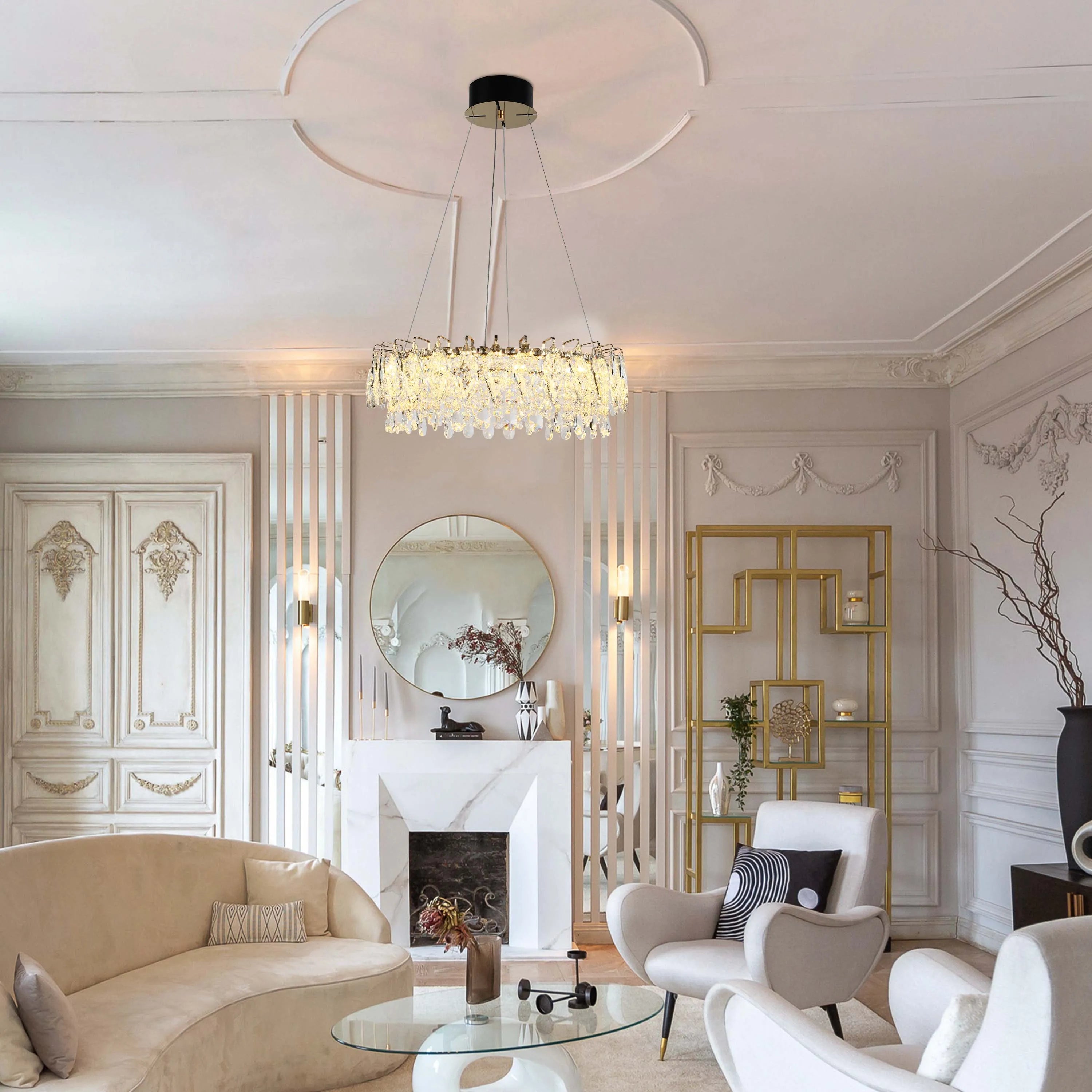 The living room has a chandelier and wall lights. The chandelier is made of crystals and is a circular shape.