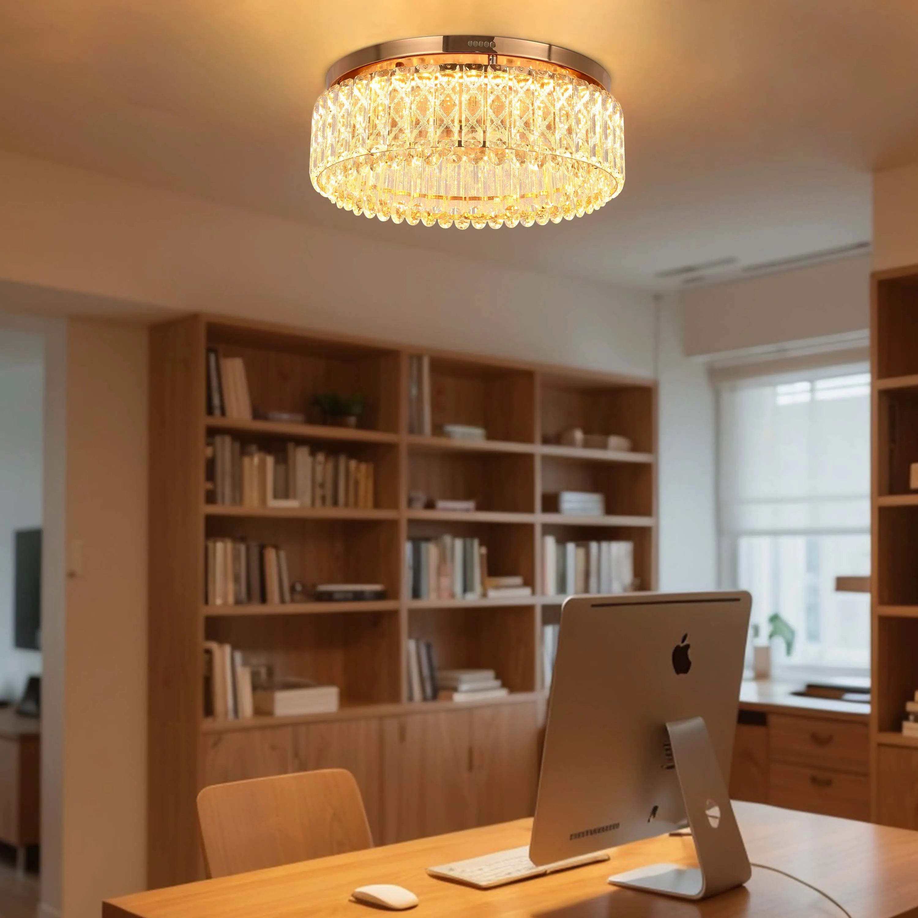 A crystal-studded flush mount ceiling light illuminates a home office with warm, ambient lighting.