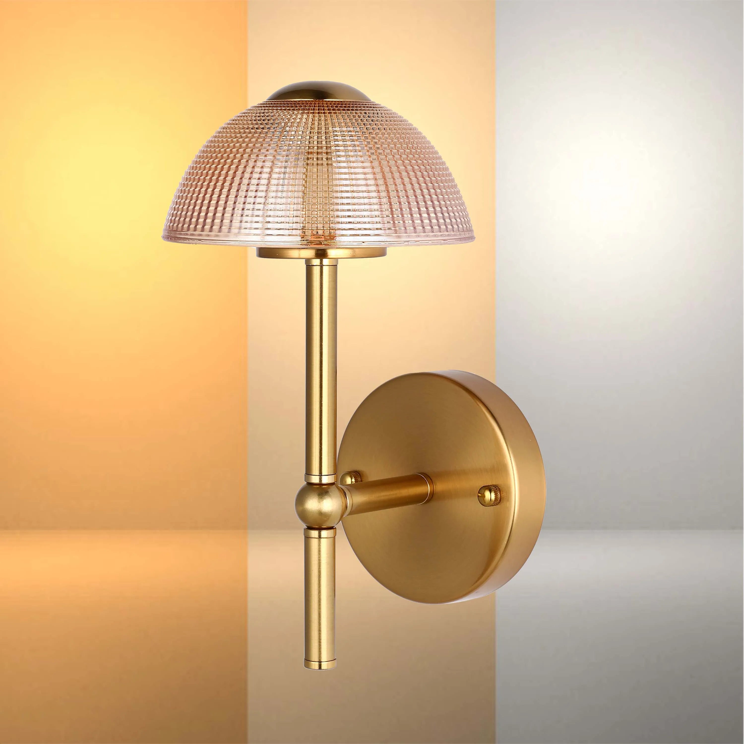 A stylish gold wall light with a textured glass shade, providing a warm and inviting glow.