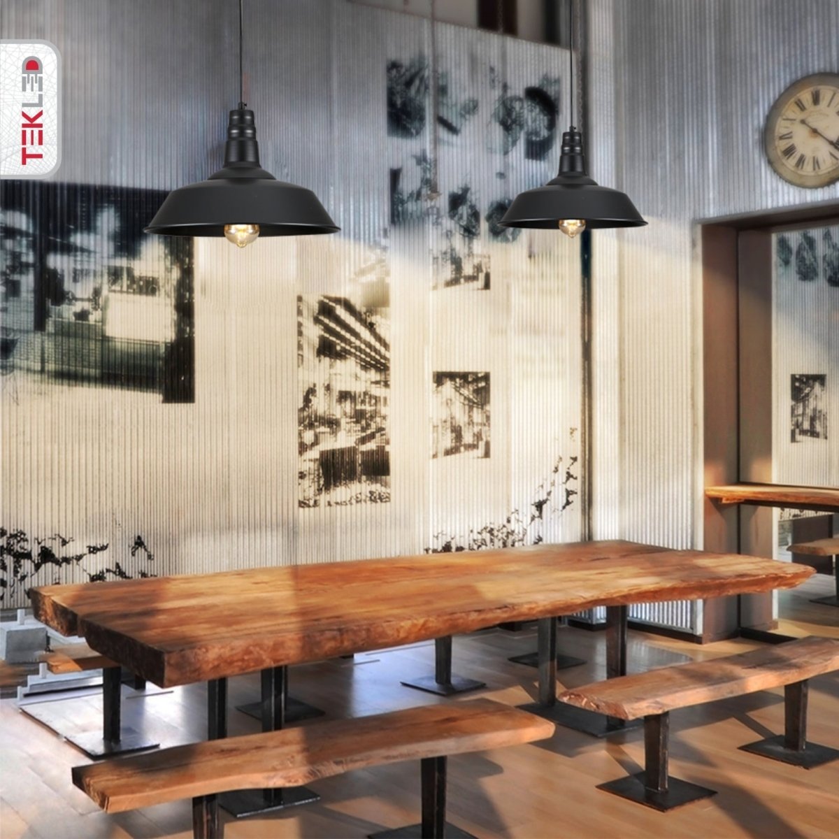 Industrial-style dining set featuring a rustic wood table and matching benches, illuminated by pendant lights.