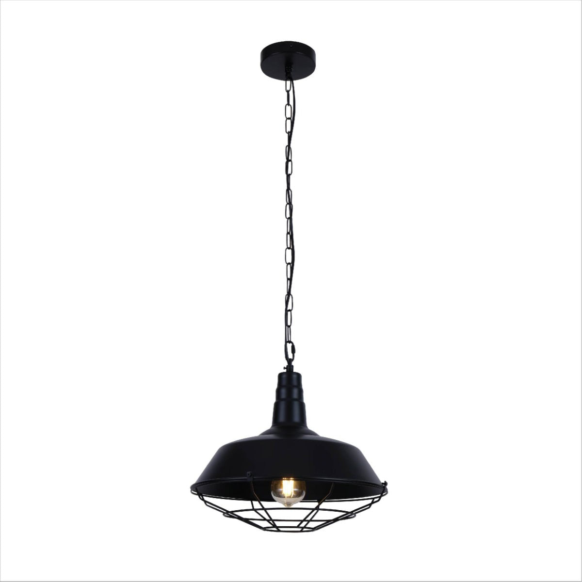 A black industrial pendant light with a cage shade hangs from a chain, emitting a warm glow.