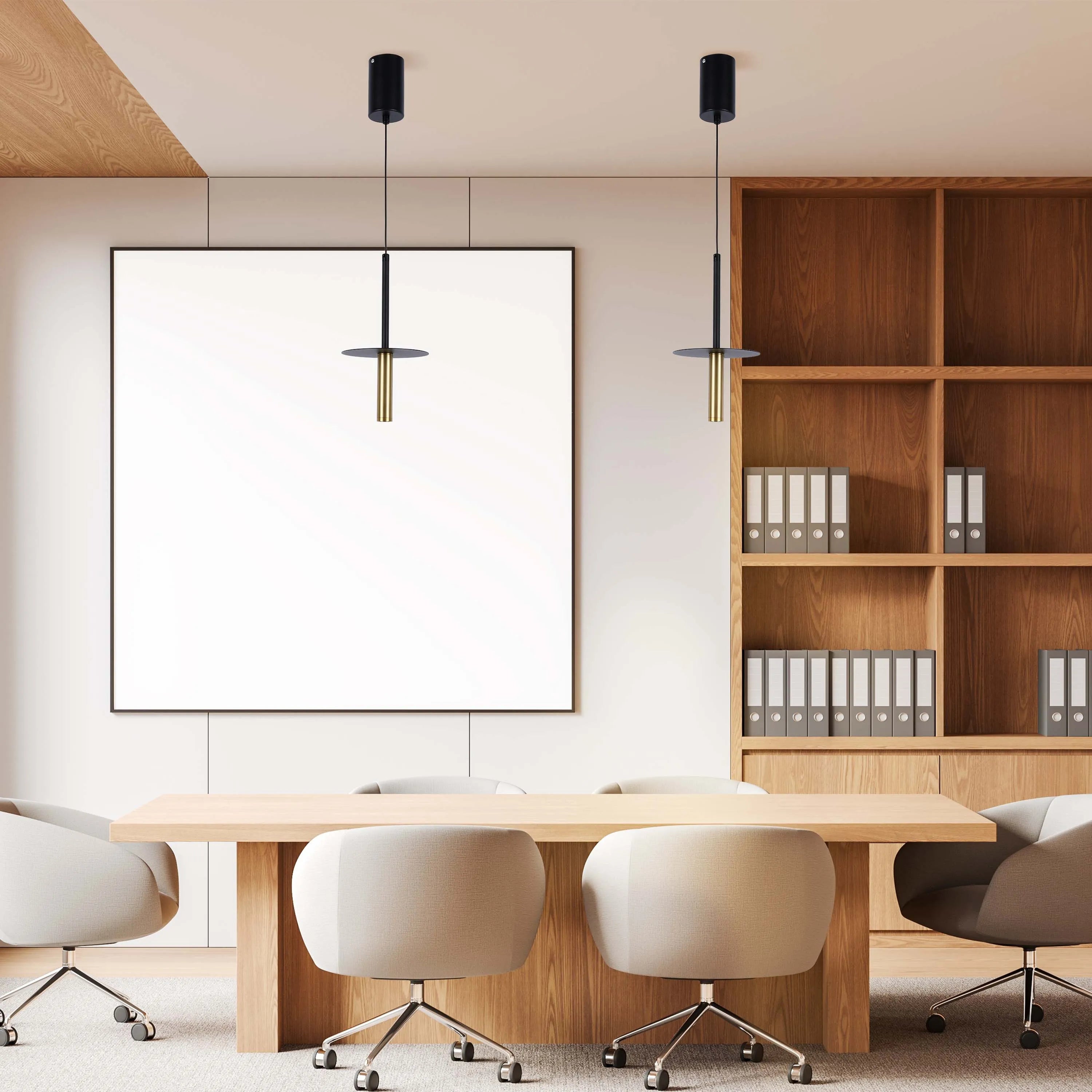 Modern office lighting featuring two pendant lights with cylindrical shades and black and gold accents, illuminating a conference table.