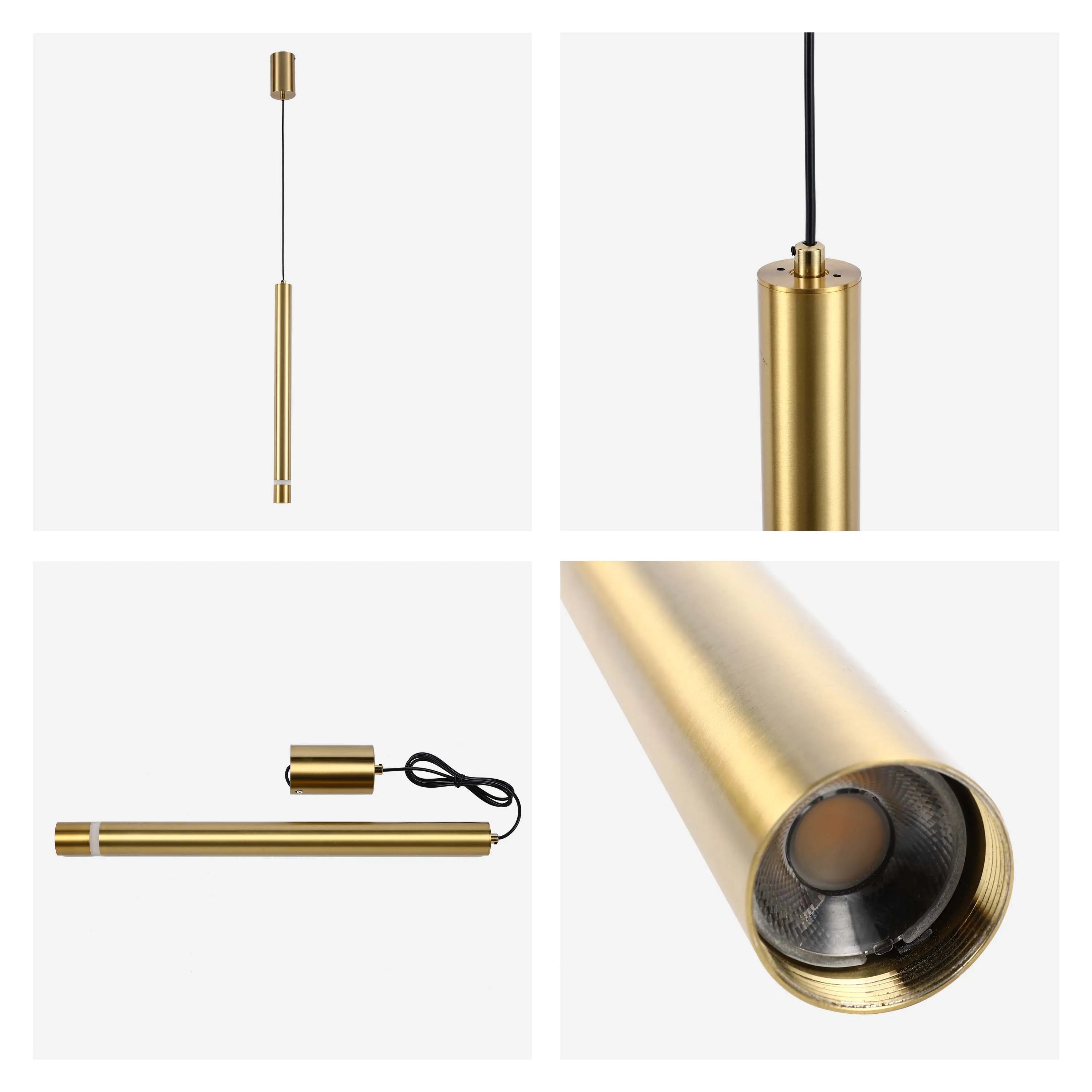 Modern gold cylinder pendant light. Sleek design, ideal for minimalist interiors. Features a suspended cable and bright LED spotlight.