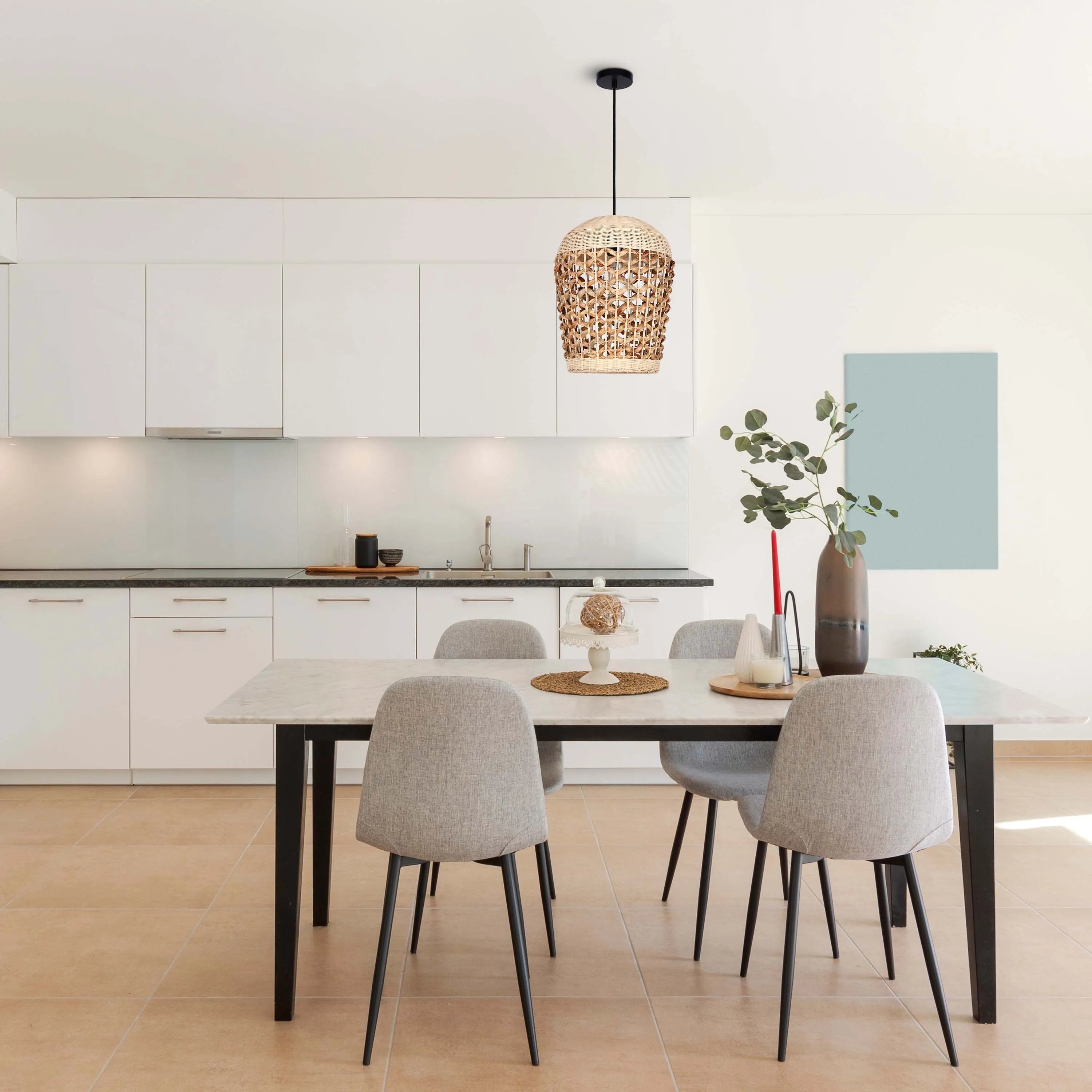 A dining room is illuminated by a woven pendant light, suspended above a table with modern chairs. Natural light streams in.