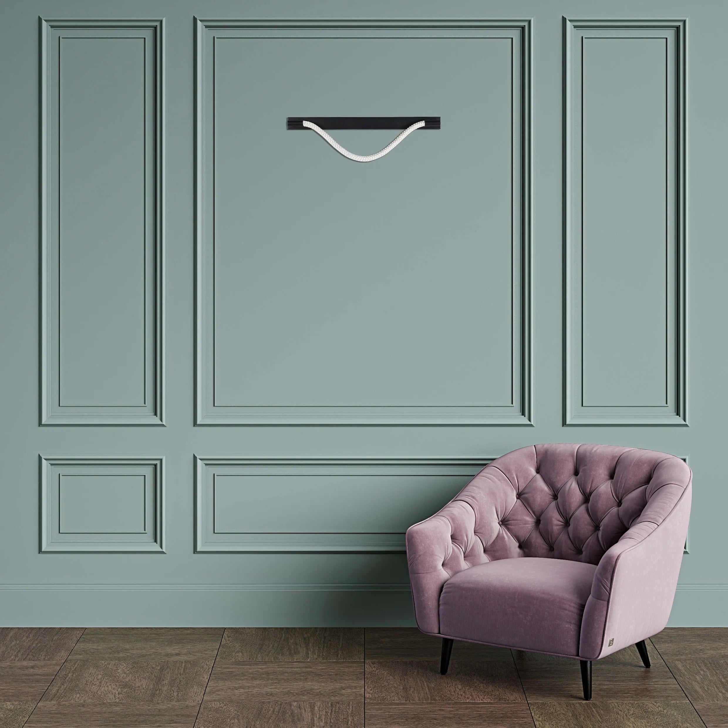 A modern wall light, suspended from a black shelf, casts a soft light on the pastel green wall. A plush purple armchair sits below.