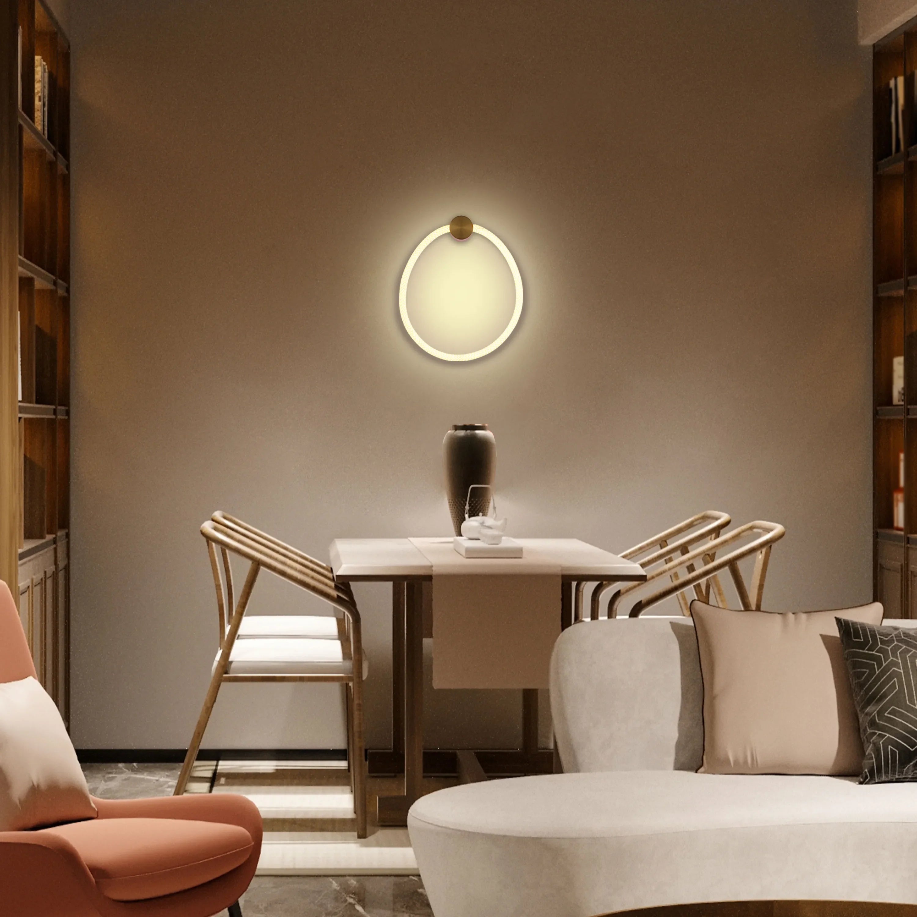 A modern circular wall light illuminates the room, providing a soft and stylish glow, accentuating the wall decor.