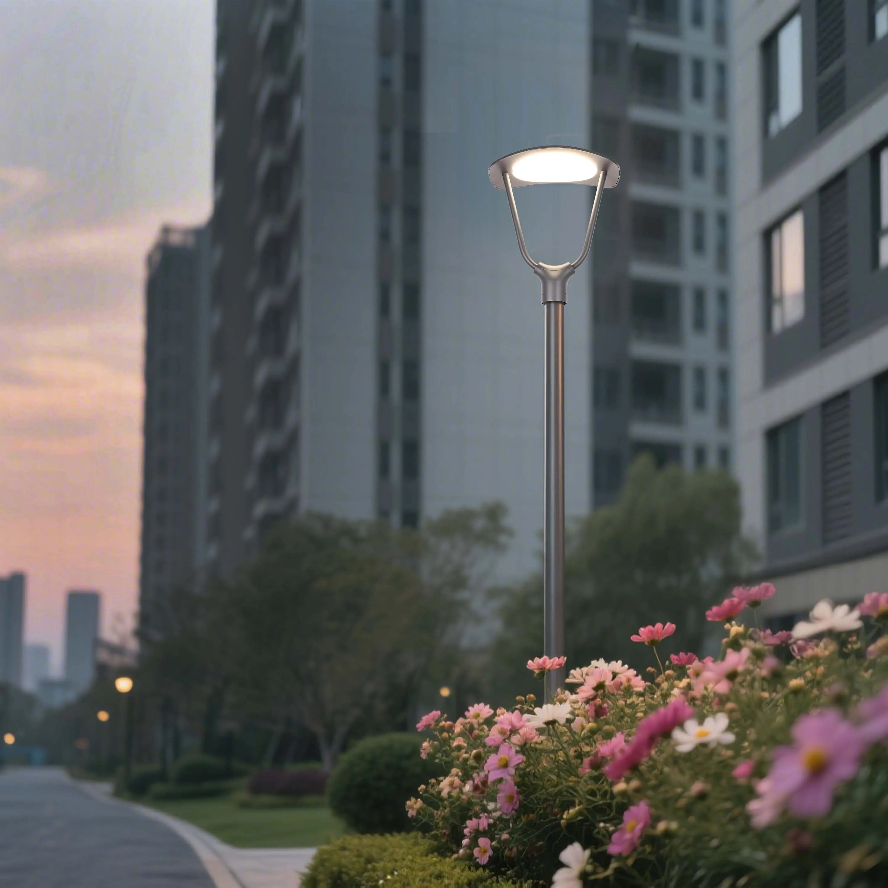 Modern street light illuminating a path at dusk, surrounded by flowers. Soft, ambient lighting provides a welcoming atmosphere.