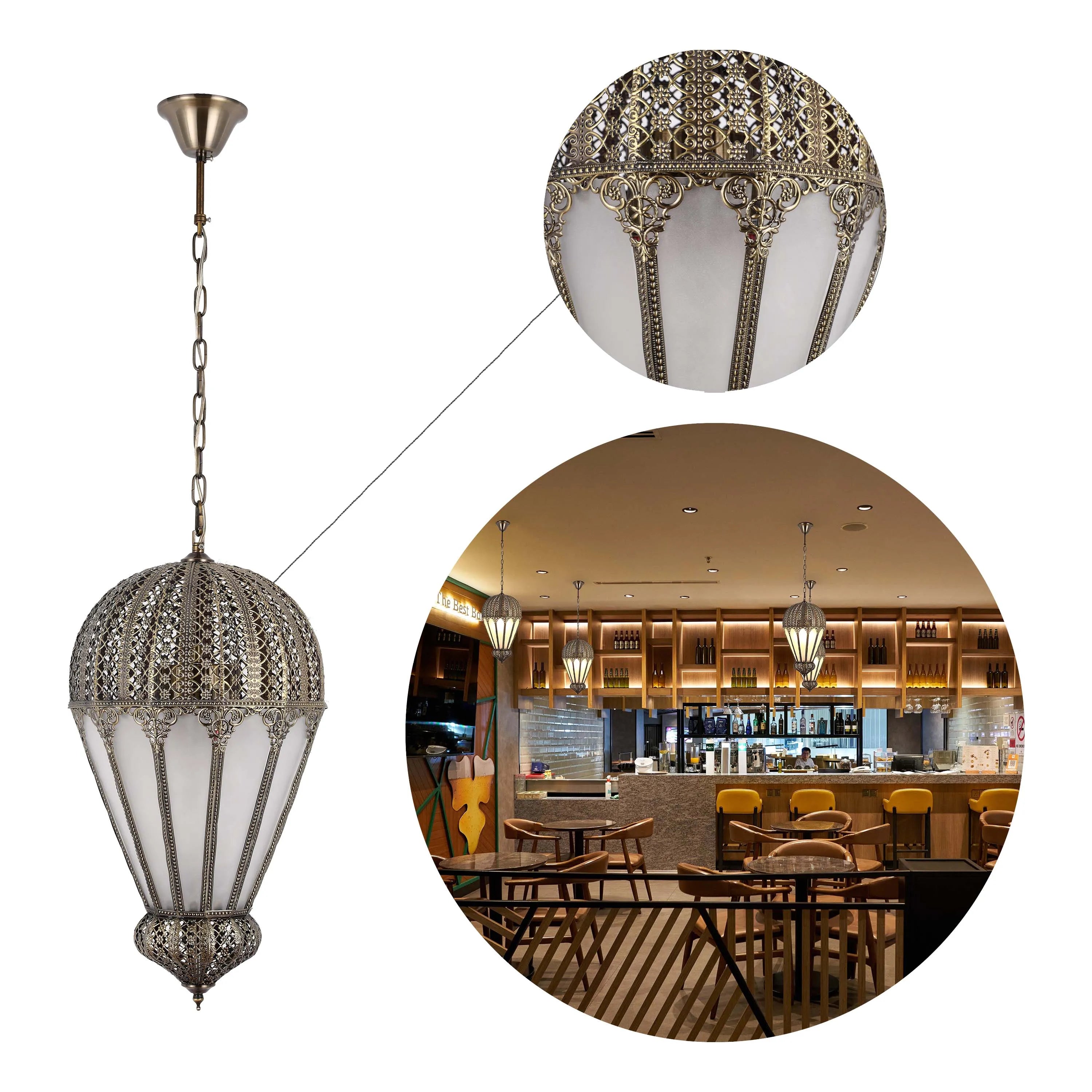 Ornate pendant light fitting in bronze over a bar and dining area. Showing detailed close up of the light's decoration.