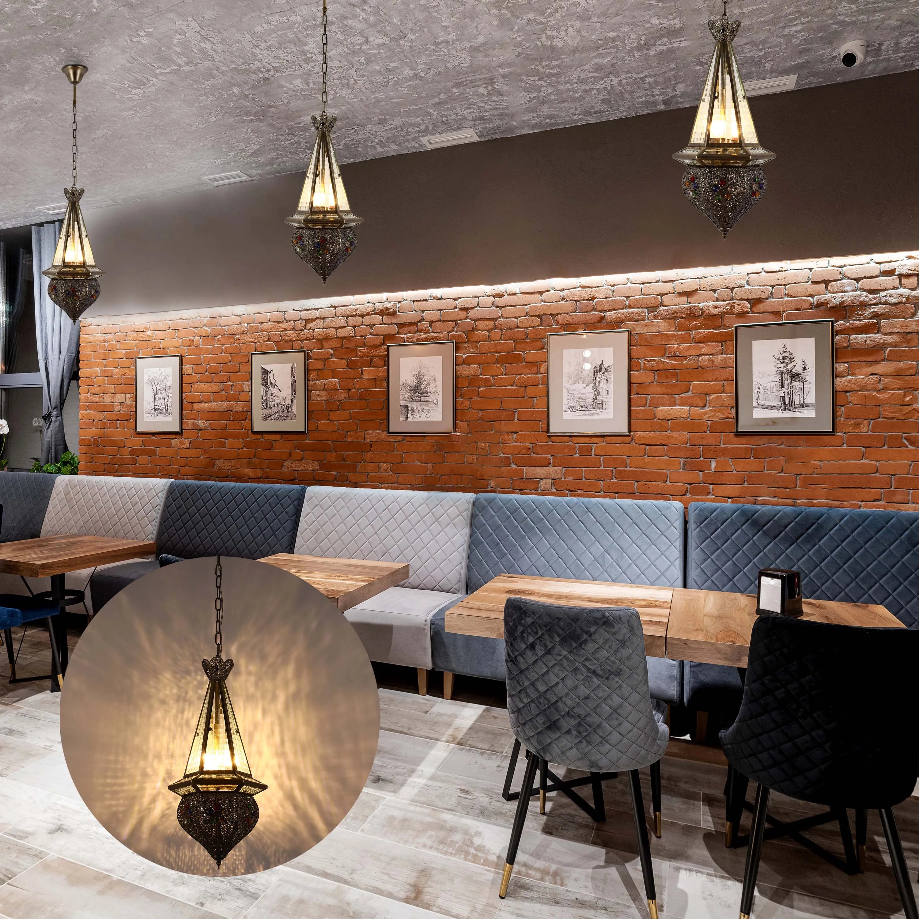 A trio of ornate, jewel-toned pendant lights hang in this stylish restaurant, casting a warm glow.