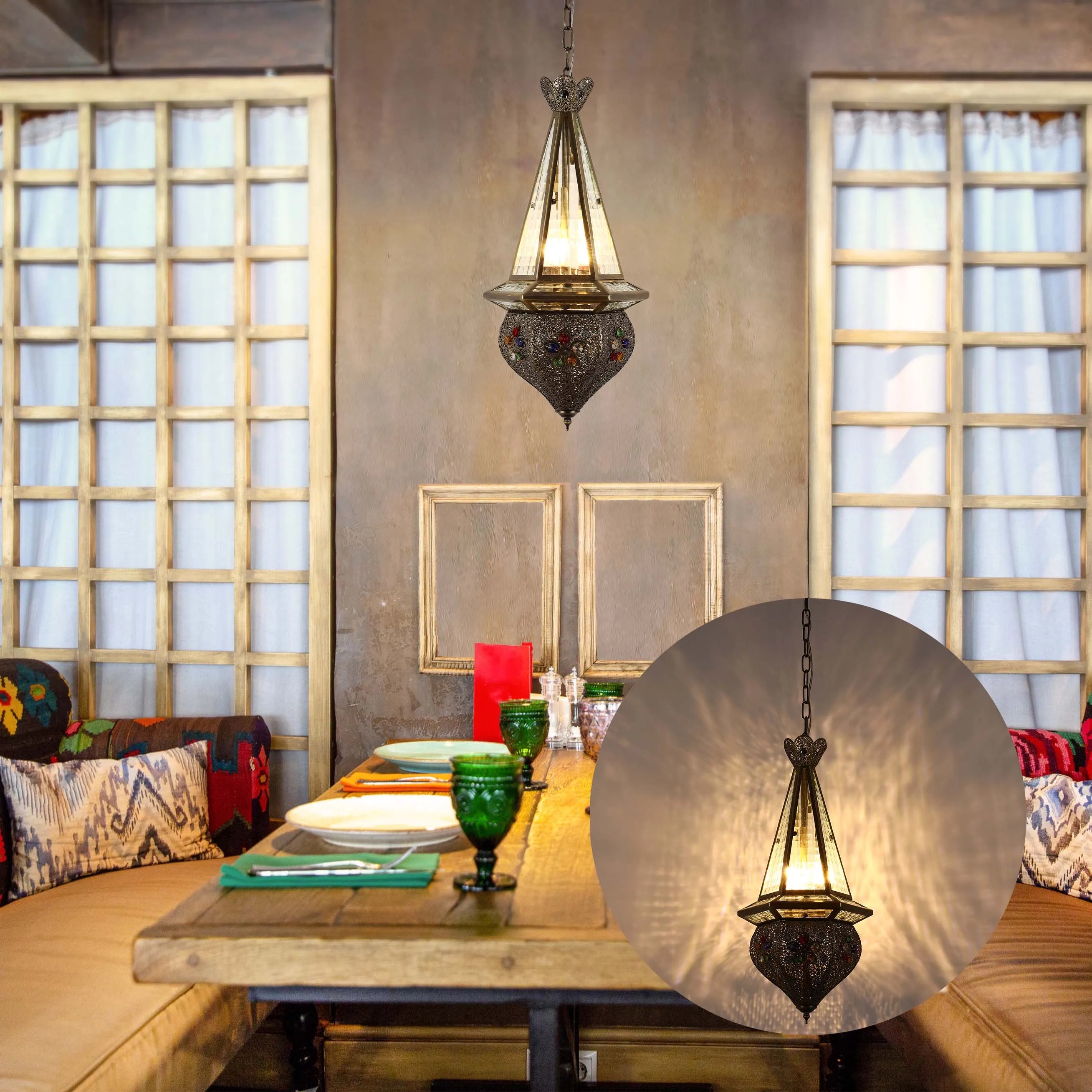 A Moroccan-style hanging light fixture adds a touch of exotic charm to this dining area, casting a warm, inviting glow.