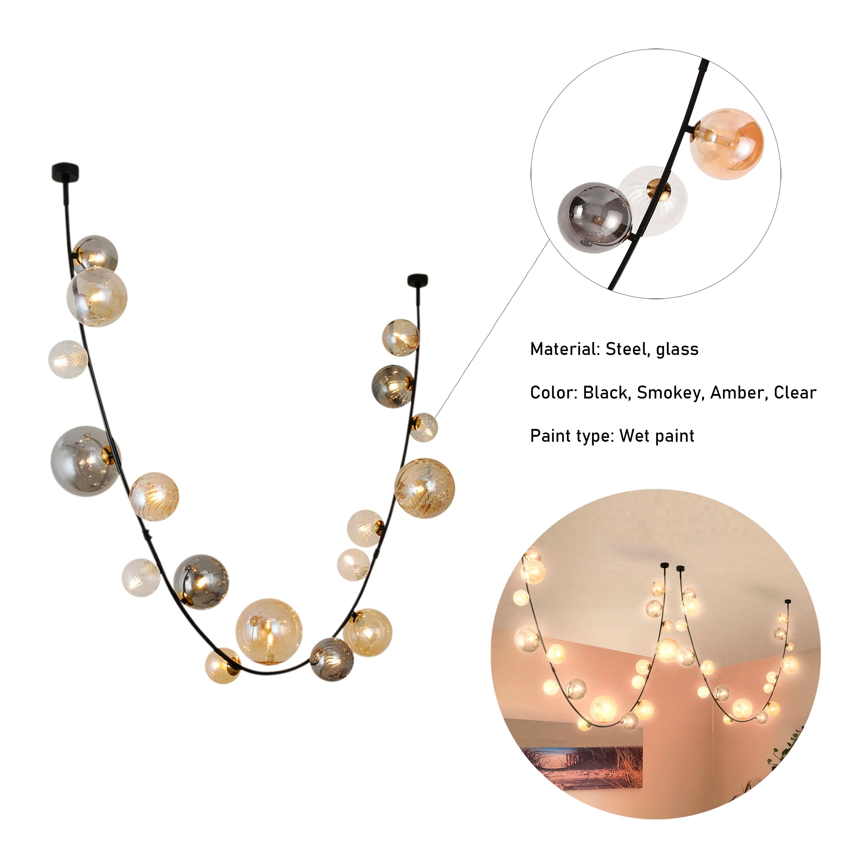 Modern multi-pendant ceiling light with smokey, amber and clear glass spheres on a black cable, creating a unique focal point.