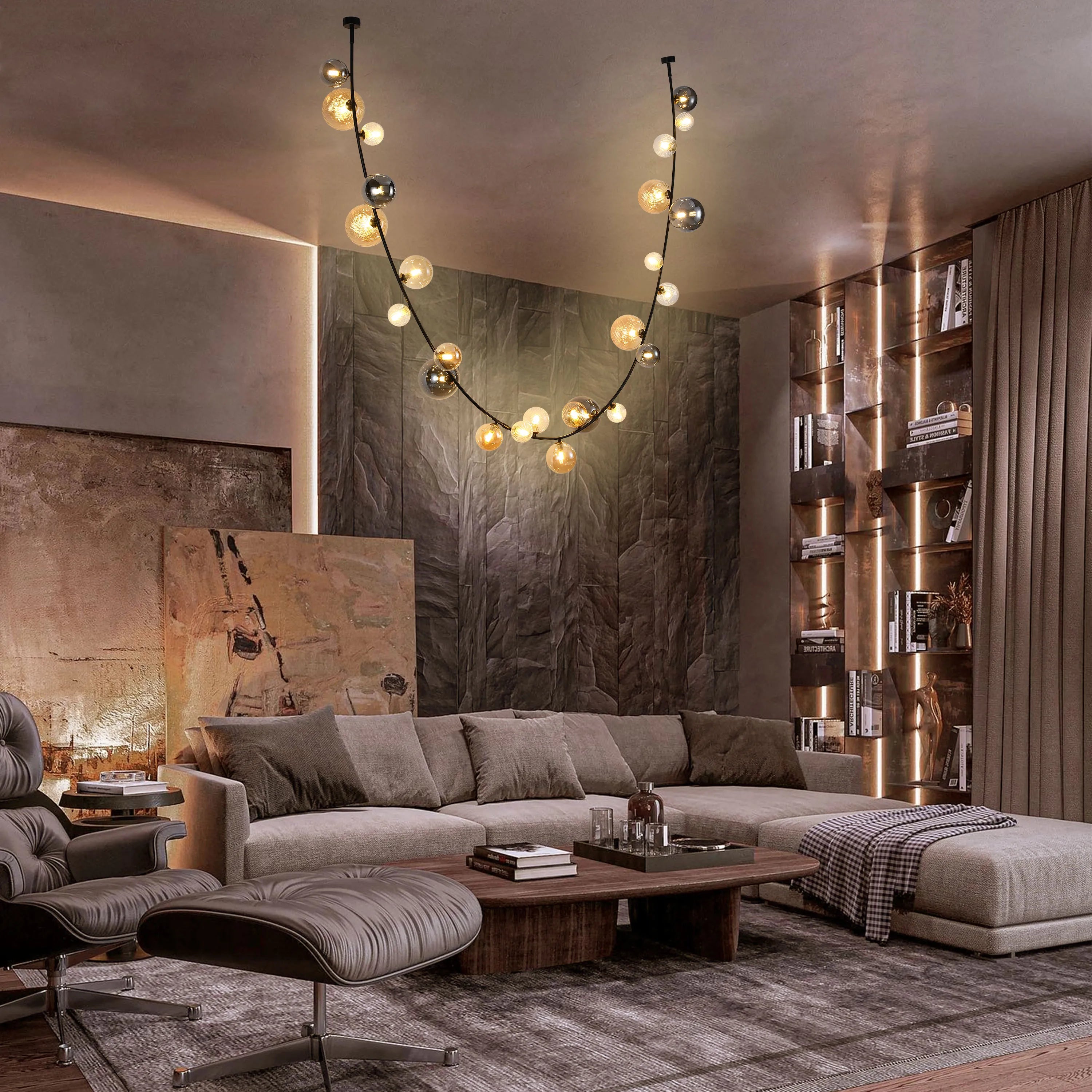 A stylish living room featuring a modern, orb pendant light fixture, providing a warm and inviting ambiance.