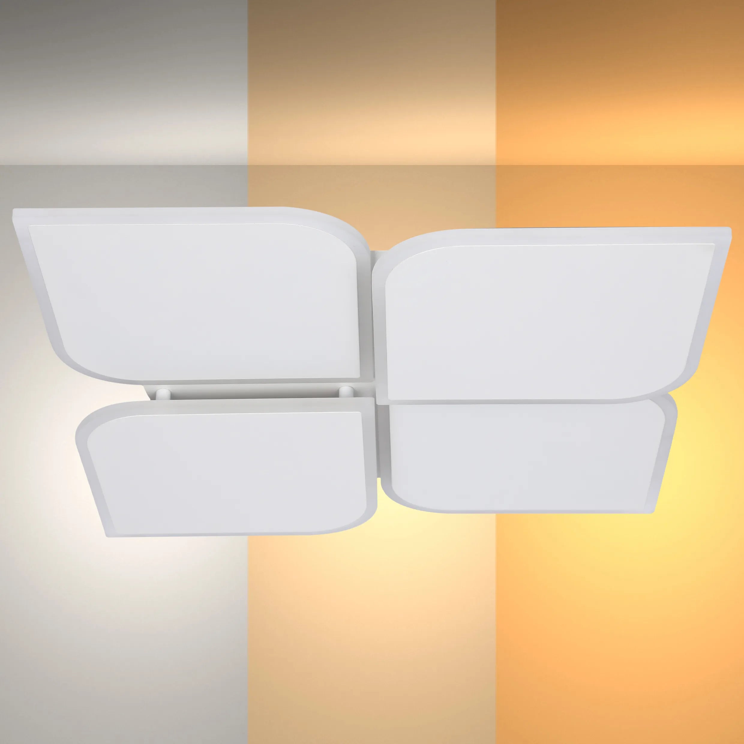 Contemporary four-panel LED ceiling light fixture with soft, ambient illumination against a multi-toned backdrop.