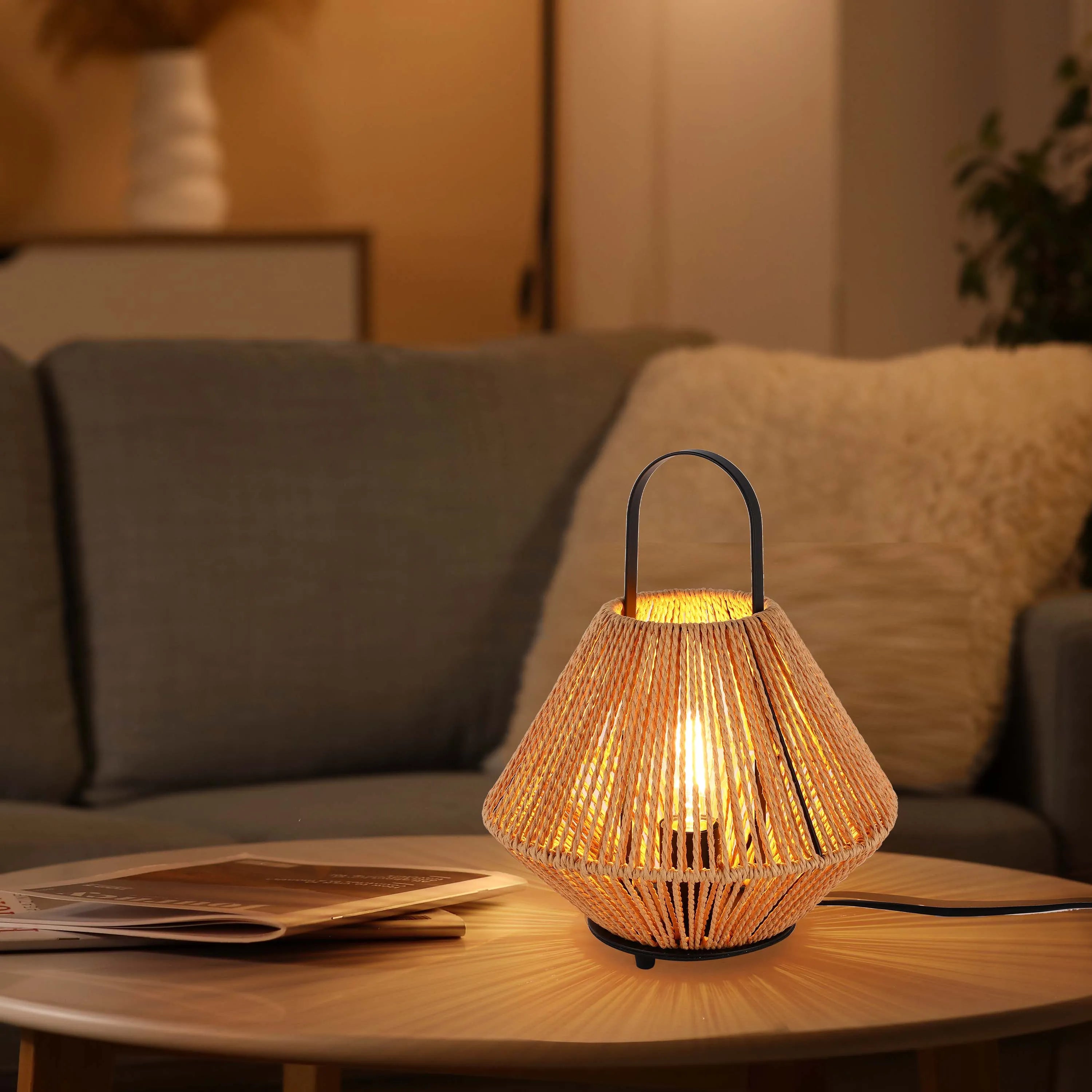 A warm, atmospheric glow from a rope-covered table lamp, perfect for a cosy living room or bedroom.